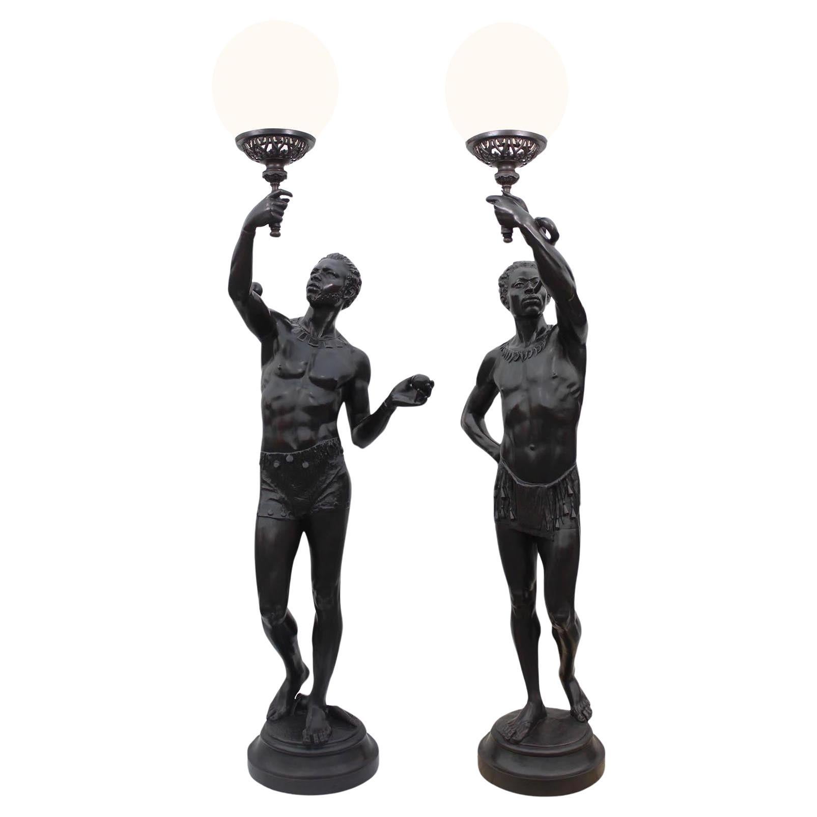 A Life-Size Pair French Cast-Iron Torchères Sculptures Juggler & Serpent Charmer For Sale