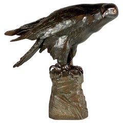 A life size terracotta bronze coloured sculpture of an eagle by Reps & Trinte.