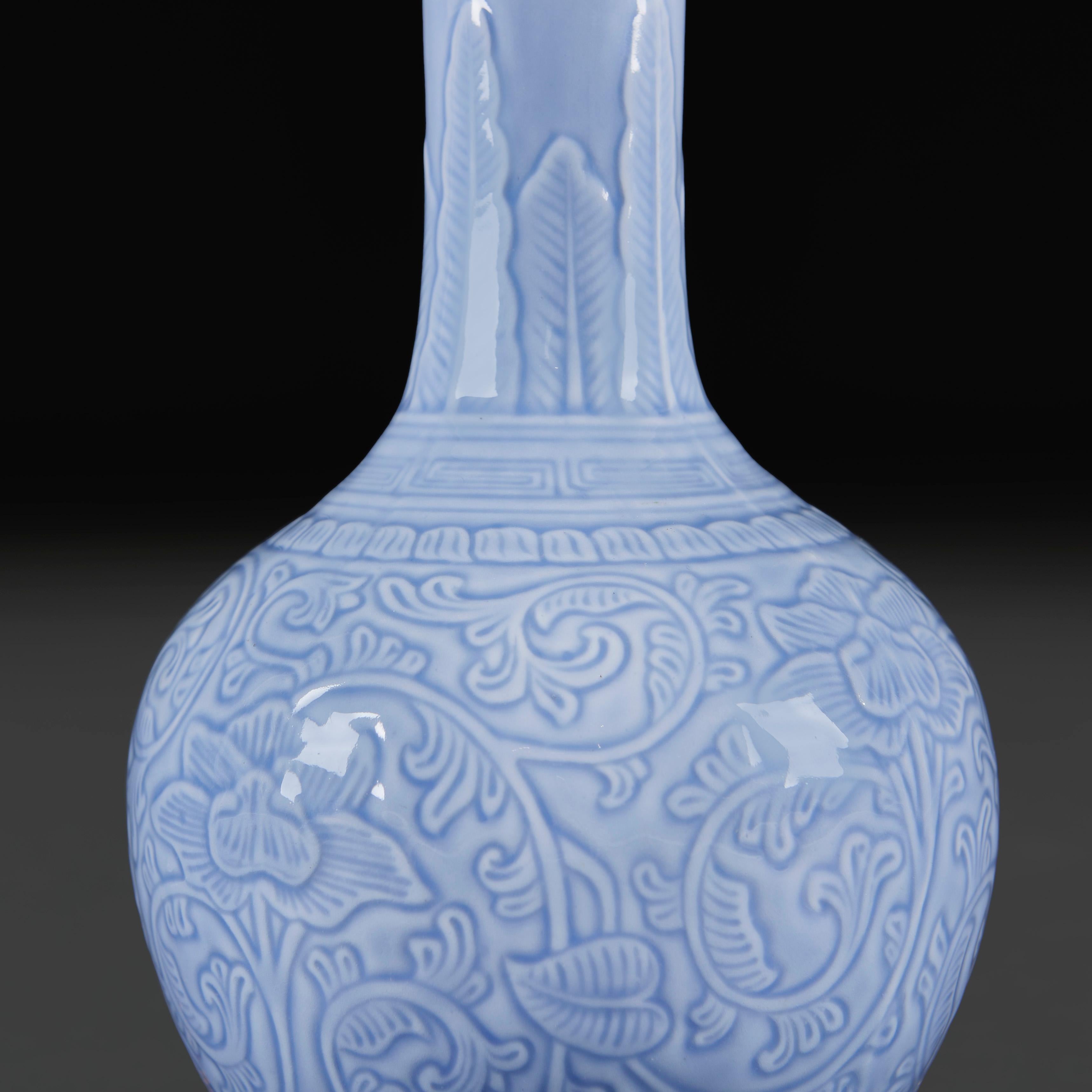 China, circa 1890

A late nineteenth century Celadon glaze bottle neck lamp, with embossed floral decoration throughout, mounted as a lamp with brass mounts. 

Height of vase   30.00cm
Height with shade   53.00cm
Diameter of base    10.00cm

Please