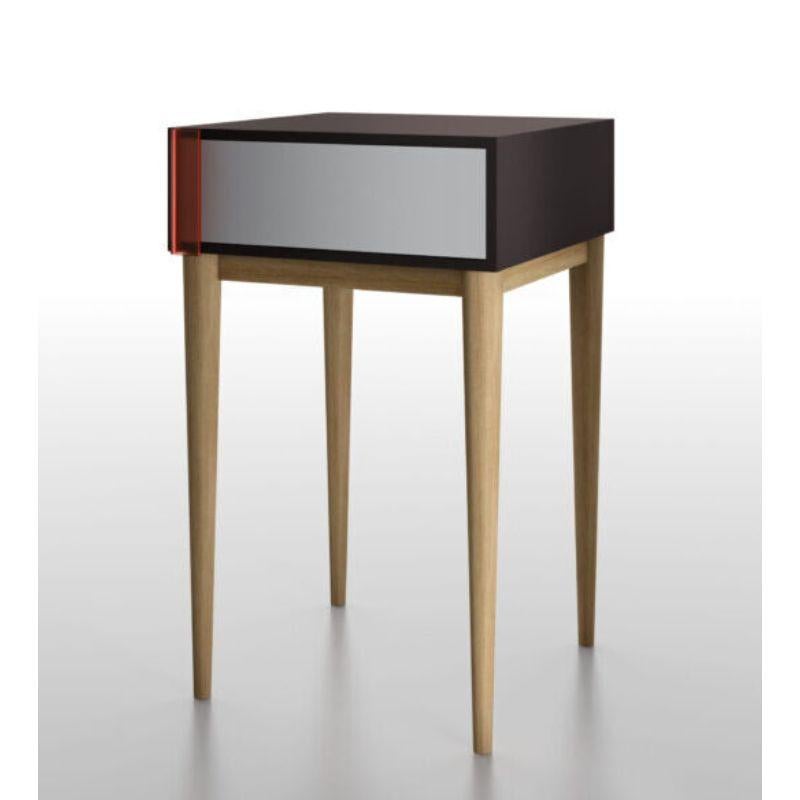 A - line side table by Colé Italia with Hagit Pincovici
Dimensions: H.65 D.40 W.40
Materials: A-line side table is composed of a drawer with a pivoting opening. The handle is in etched red translucent plexiglass. Legs in solid oak wood. Structure