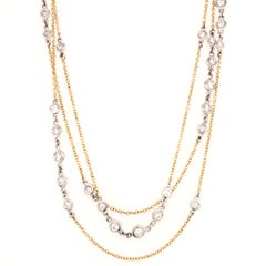 Halskette 36" in Länge aus 18 Karat Weiß- und Gelbgold mit Gliederlünette und Diamanten