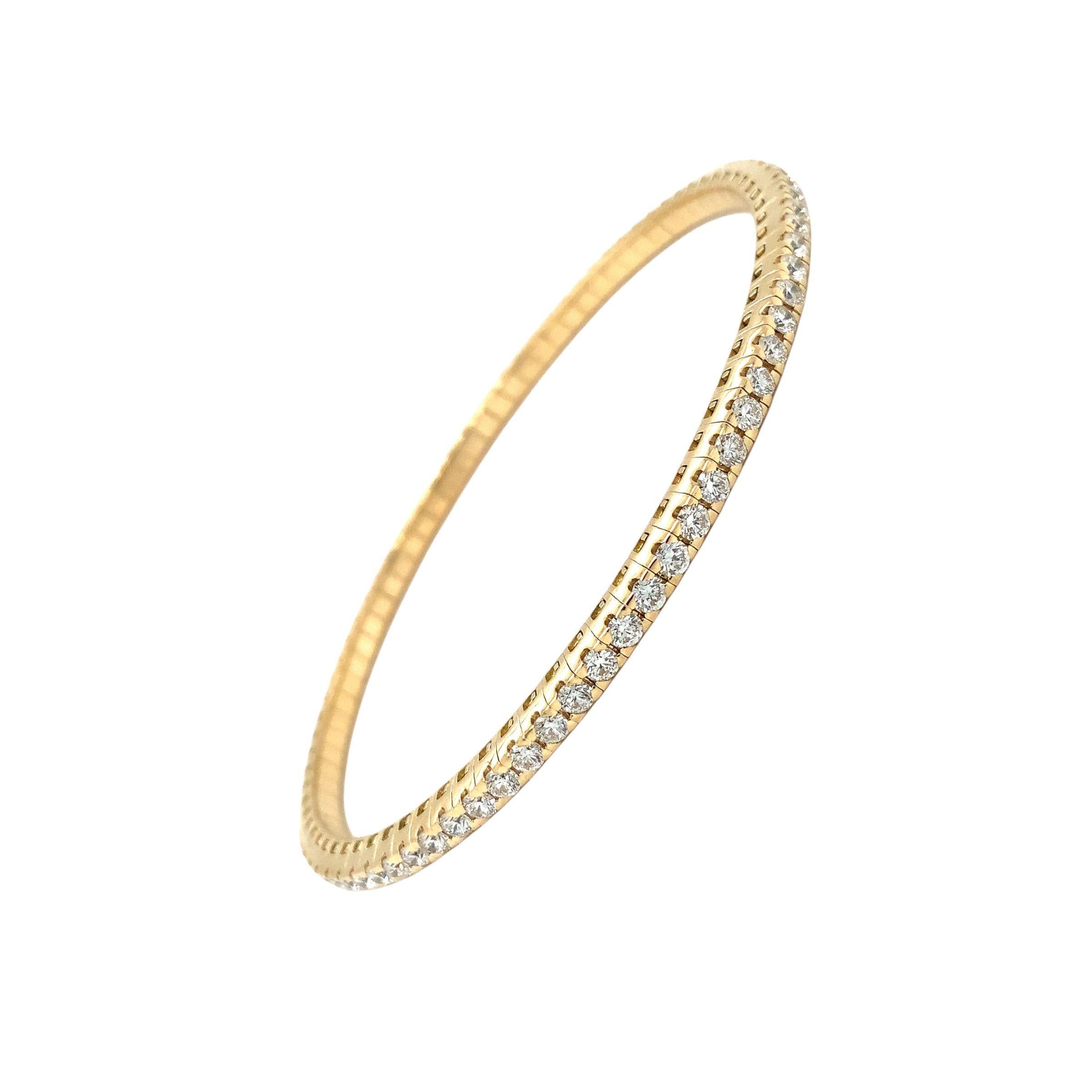 The A. Link Collection Classic Stretchy Diamond Bracelet is a captivating piece set in 18K yellow gold. Crafted with excellence, this bracelet holds an impressive 2.61 carats of Tw round brilliant cut diamonds with F color and near-flawless VS