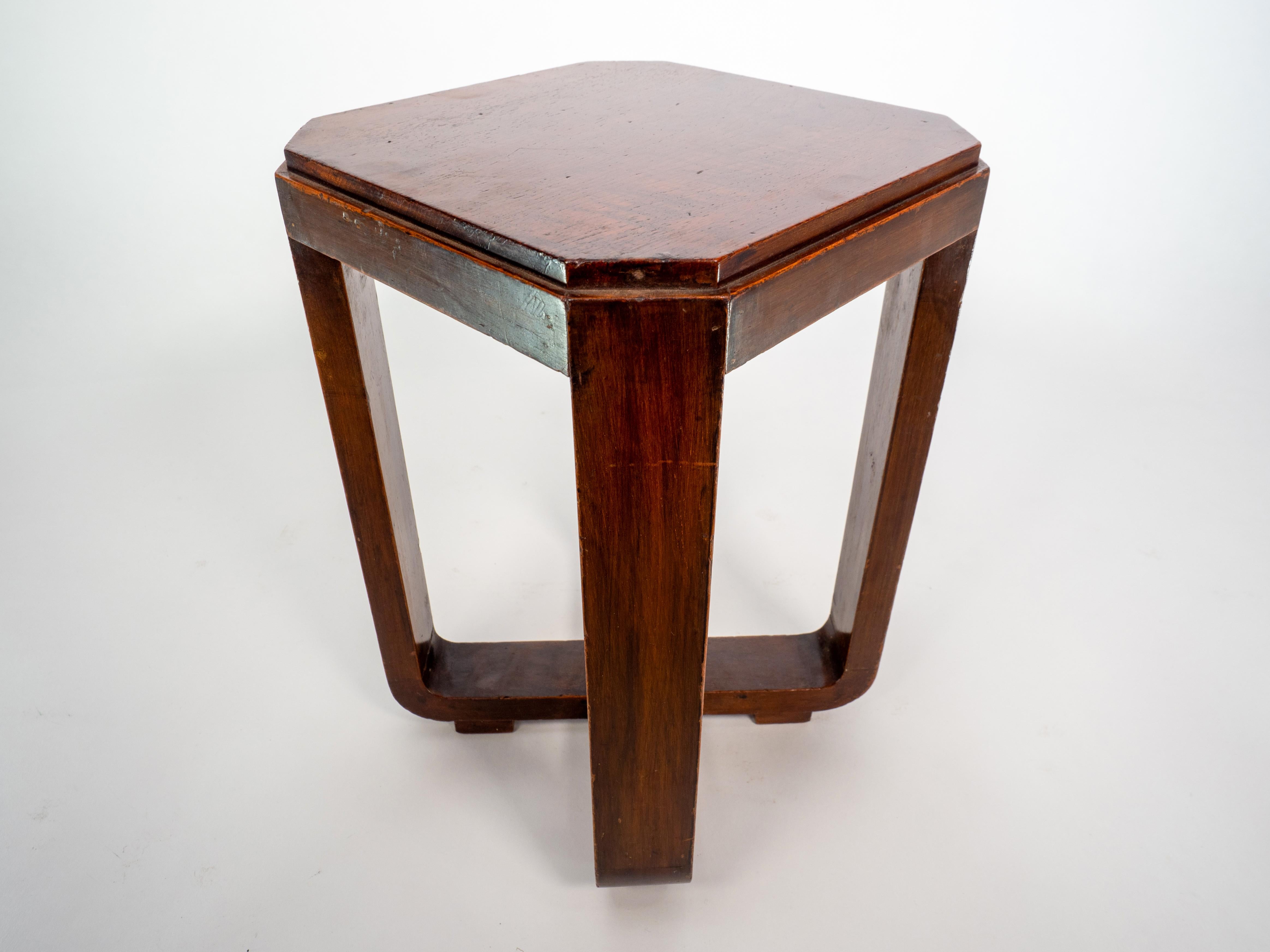 English A little Art Deco Walnut side table the legs follow down to a cross stretcher. For Sale