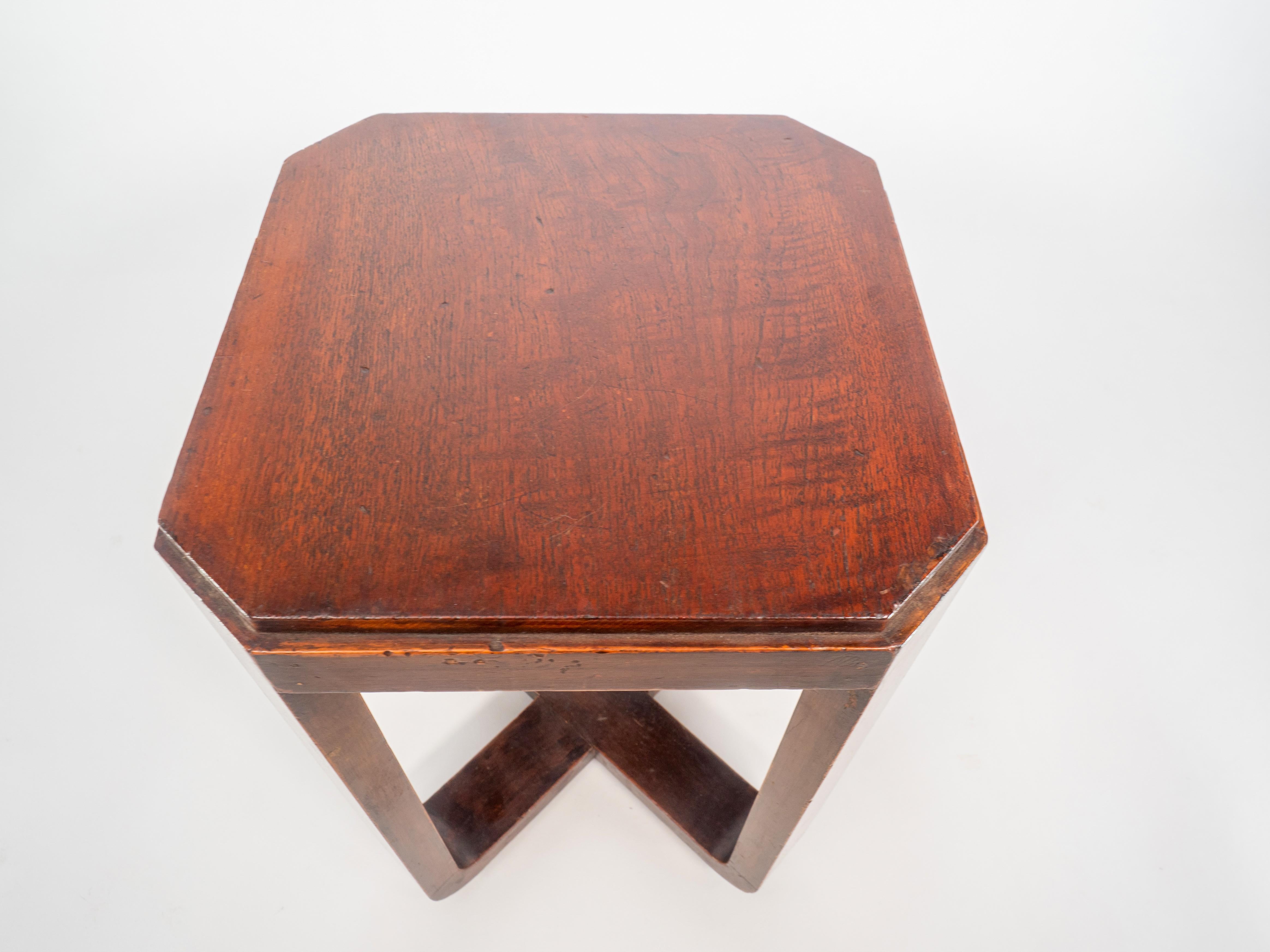 Mid-20th Century A little Art Deco Walnut side table the legs follow down to a cross stretcher. For Sale