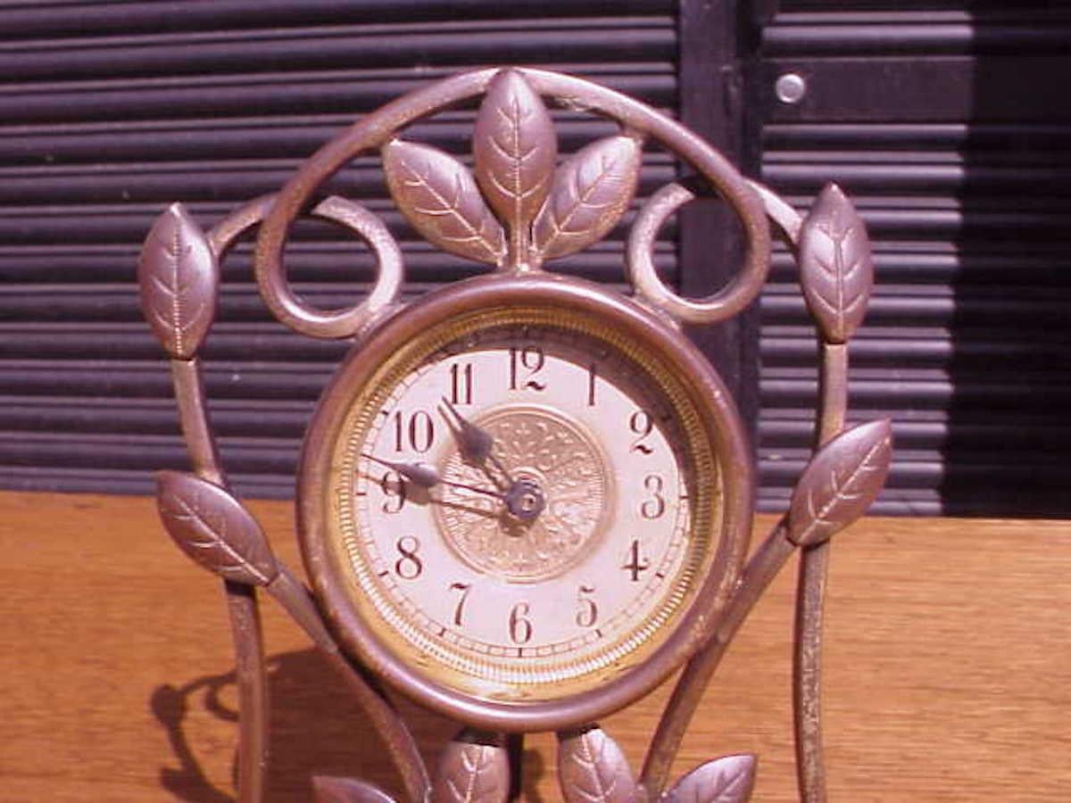 A little Arts and Crafts mantle/bedside clock with hand formed copper leaves.
Ticks away nicely and has and fast and slow adjuster so it can be quite accurate.