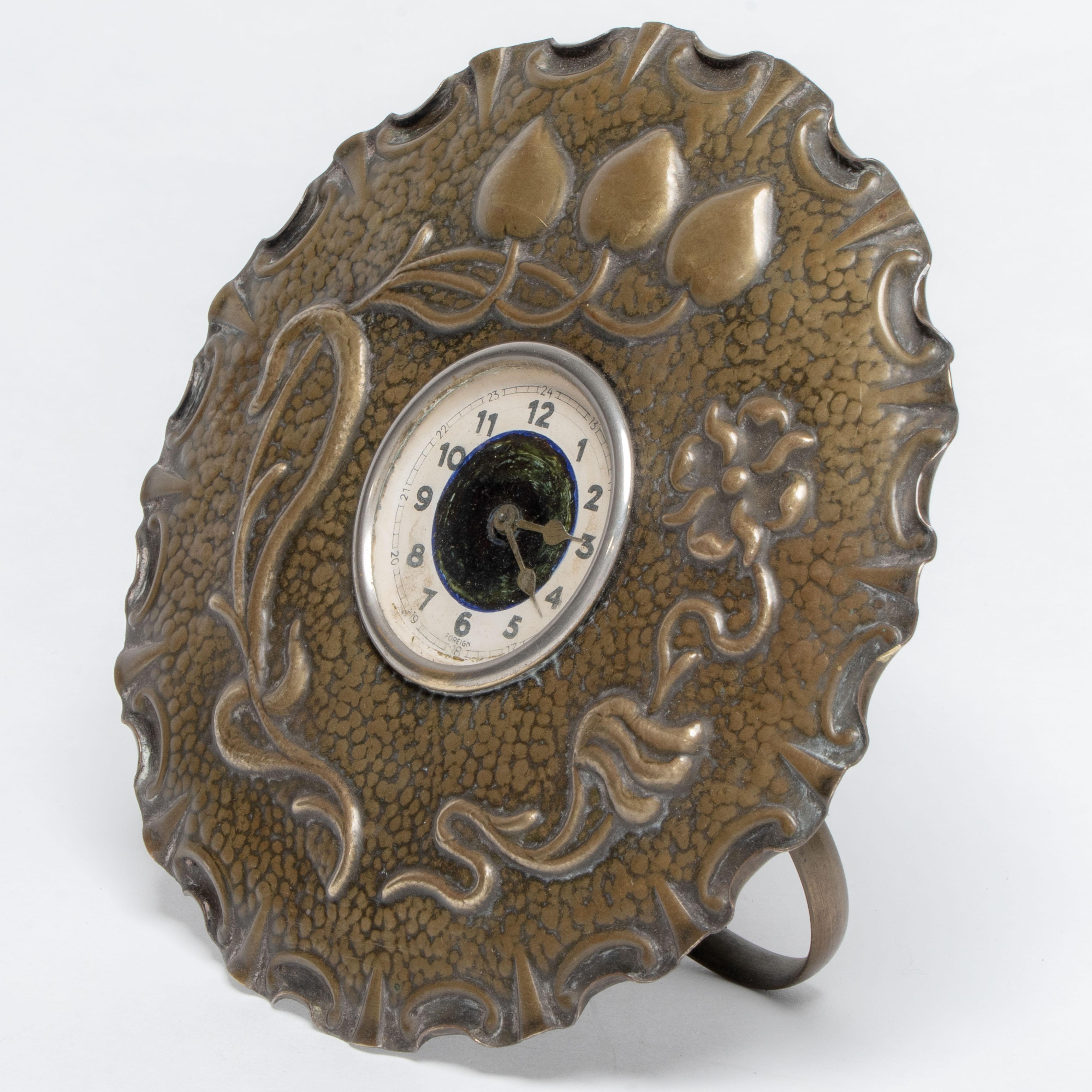 English A little Arts & Crafts copper table clock in the shape of a flower head For Sale