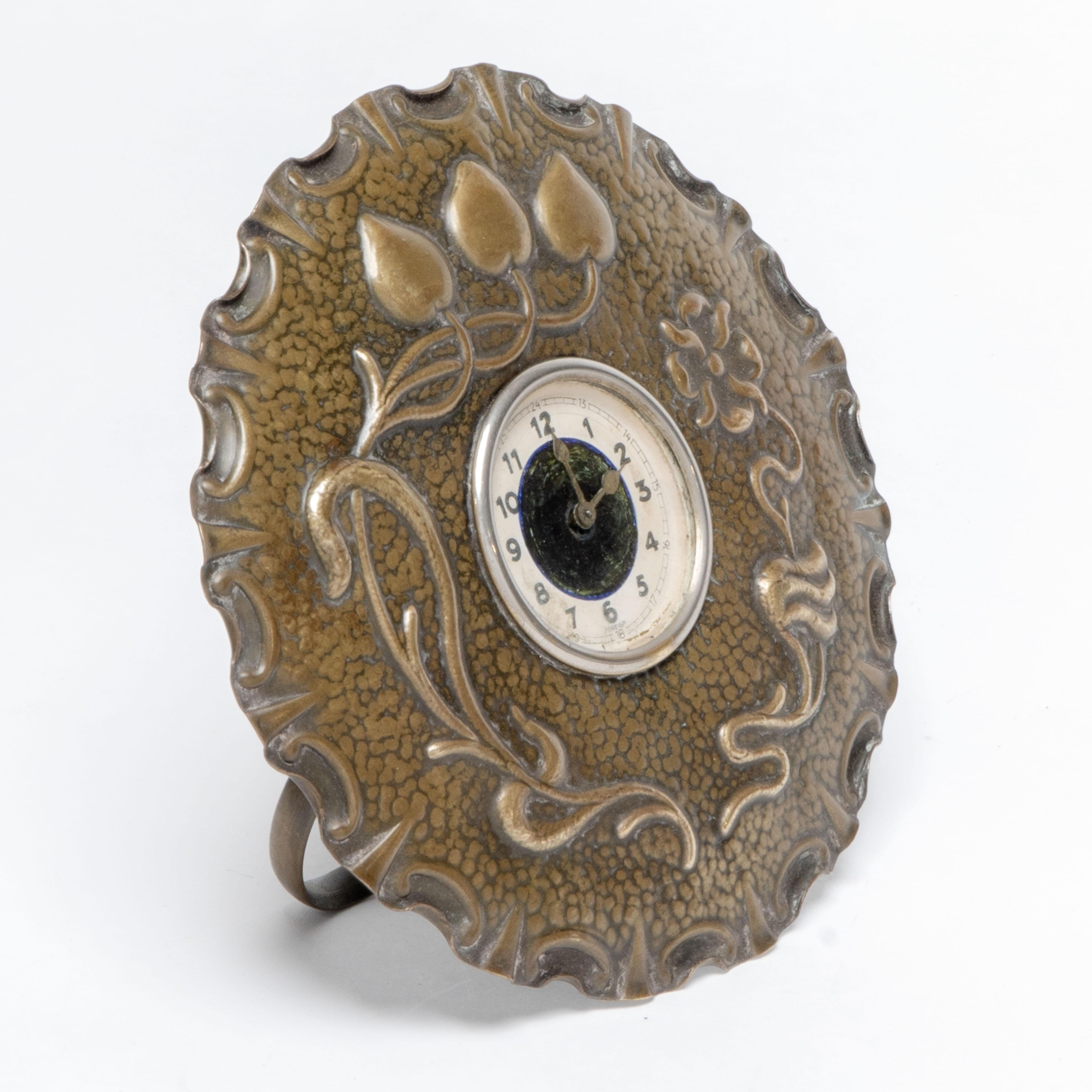 Early 20th Century A little Arts & Crafts copper table clock in the shape of a flower head For Sale