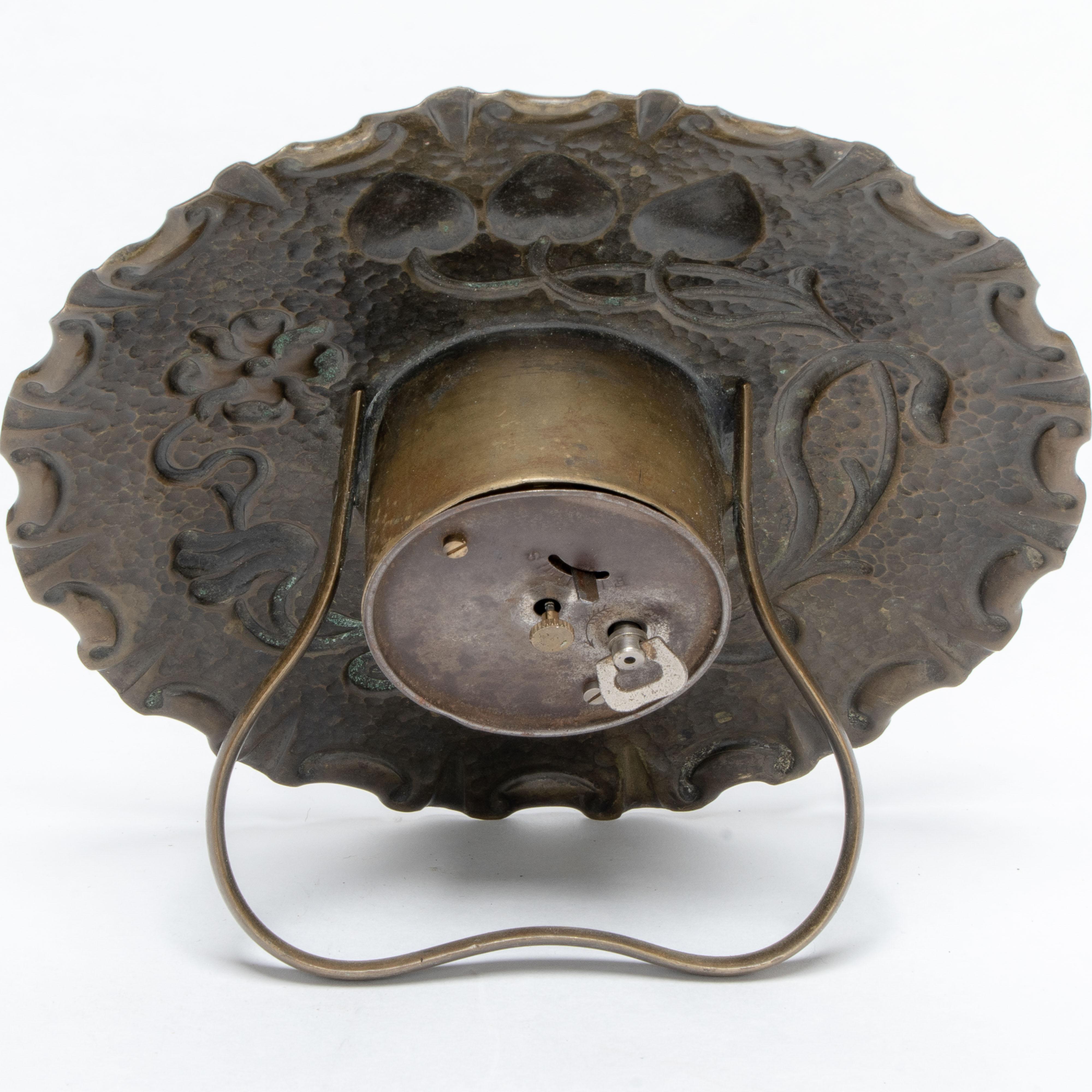 A little Arts & Crafts copper table clock in the shape of a flower head For Sale 1