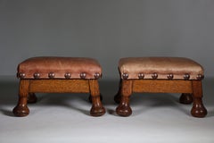 A little pair of Aesthetic Movement oak Thebe stools with leather studded seats