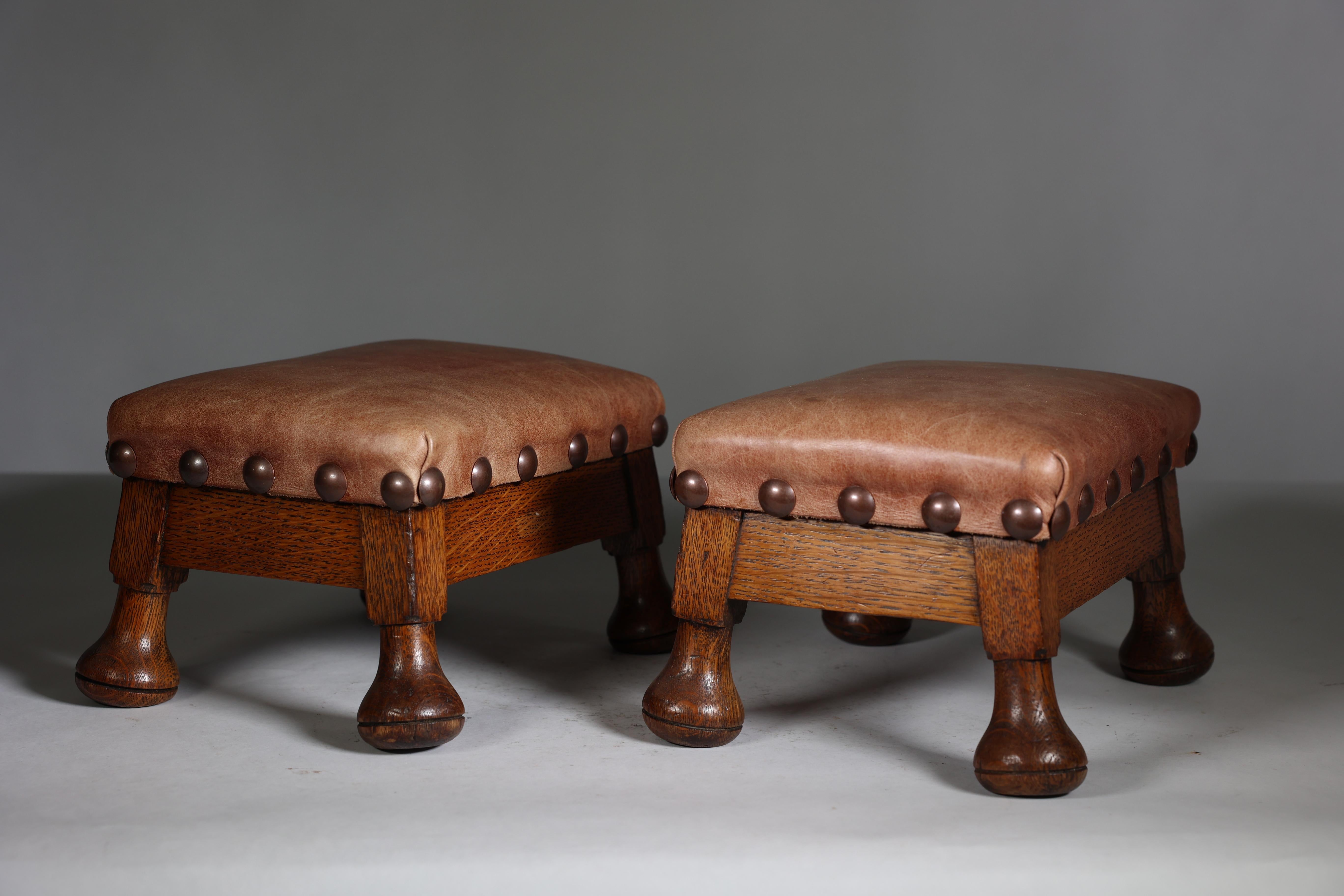 Late 19th Century A little pair of Aesthetic Movement oak Thebe stools with leather studded seats For Sale