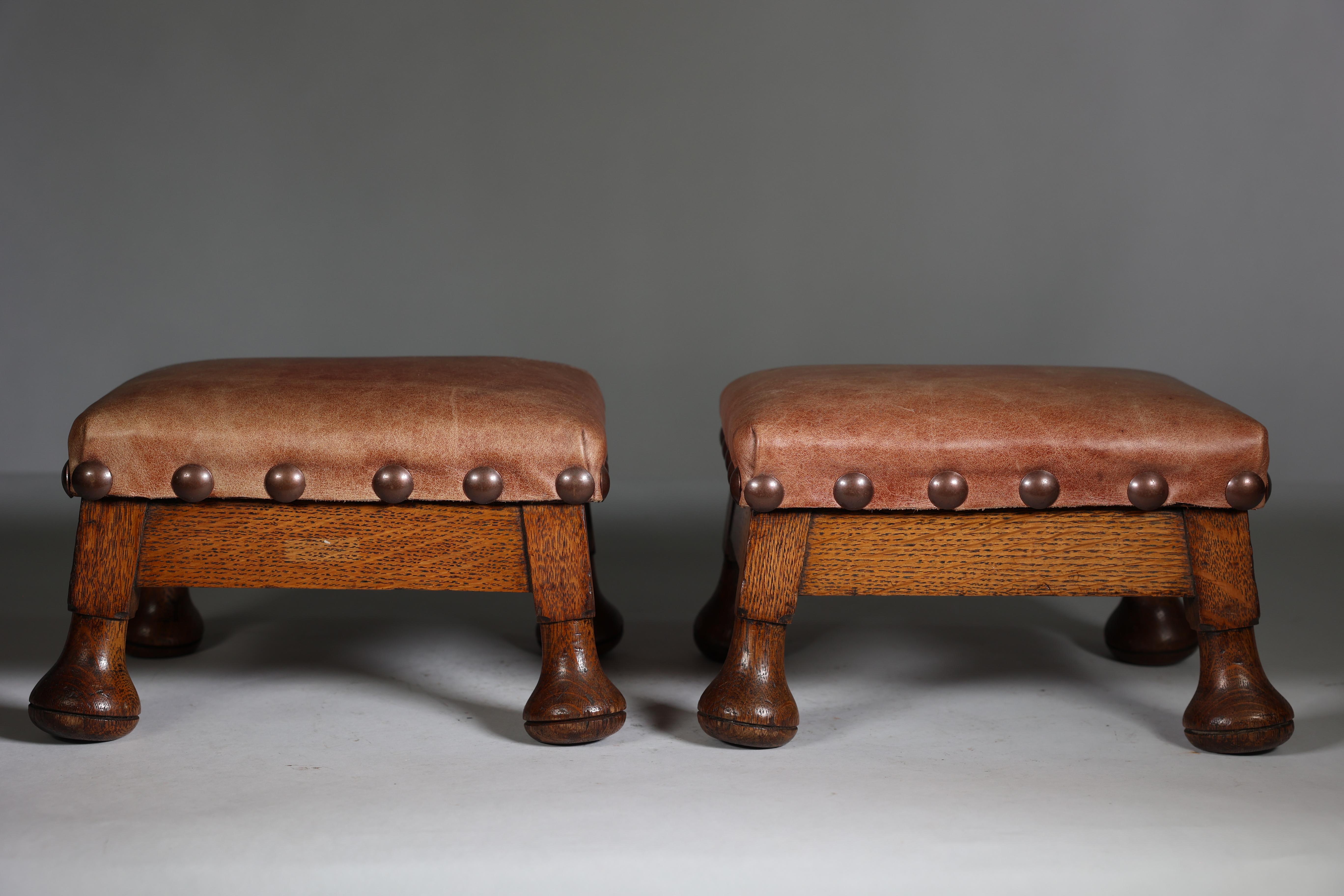 Oak A little pair of Aesthetic Movement oak Thebe stools with leather studded seats For Sale