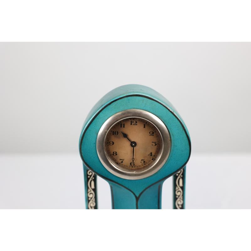 A little turquoise blue dressing table clock decorated with cherubs by a tree. For Sale 3
