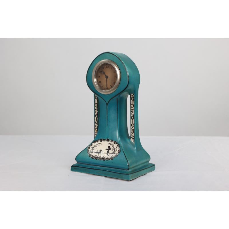 Art Nouveau A little turquoise blue dressing table clock decorated with cherubs by a tree. For Sale