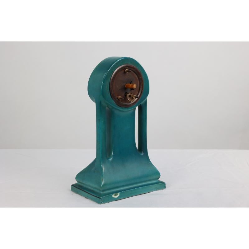 Ceramic A little turquoise blue dressing table clock decorated with cherubs by a tree. For Sale