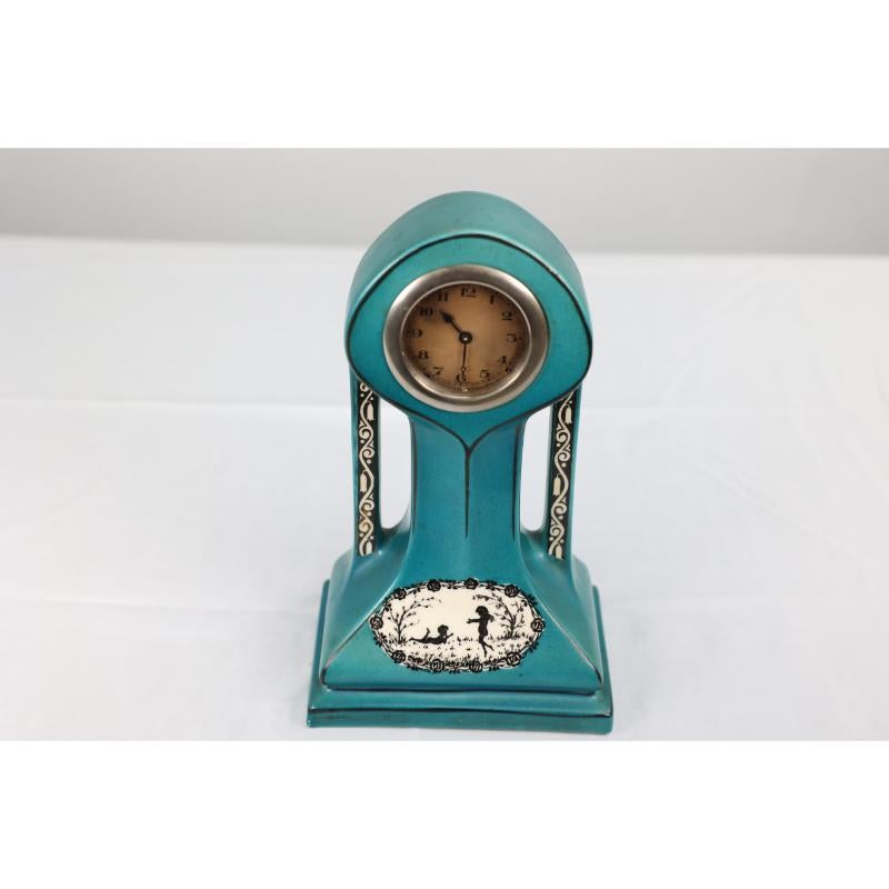 A little turquoise blue dressing table clock decorated with cherubs by a tree. For Sale 2