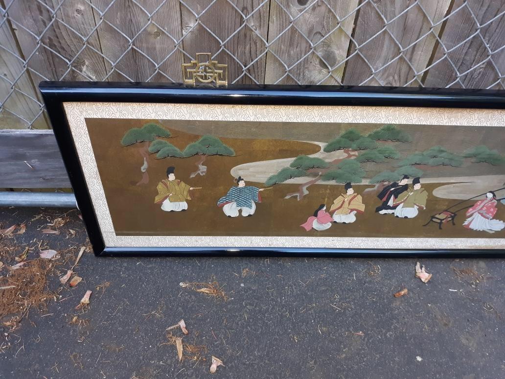 An antique horizontal Japanese Meiji period qouache watercolor painting with black lacquered frame under glass. 65.5 inches long, 17inches high. The vibrantly colored procession scene with neutral border.