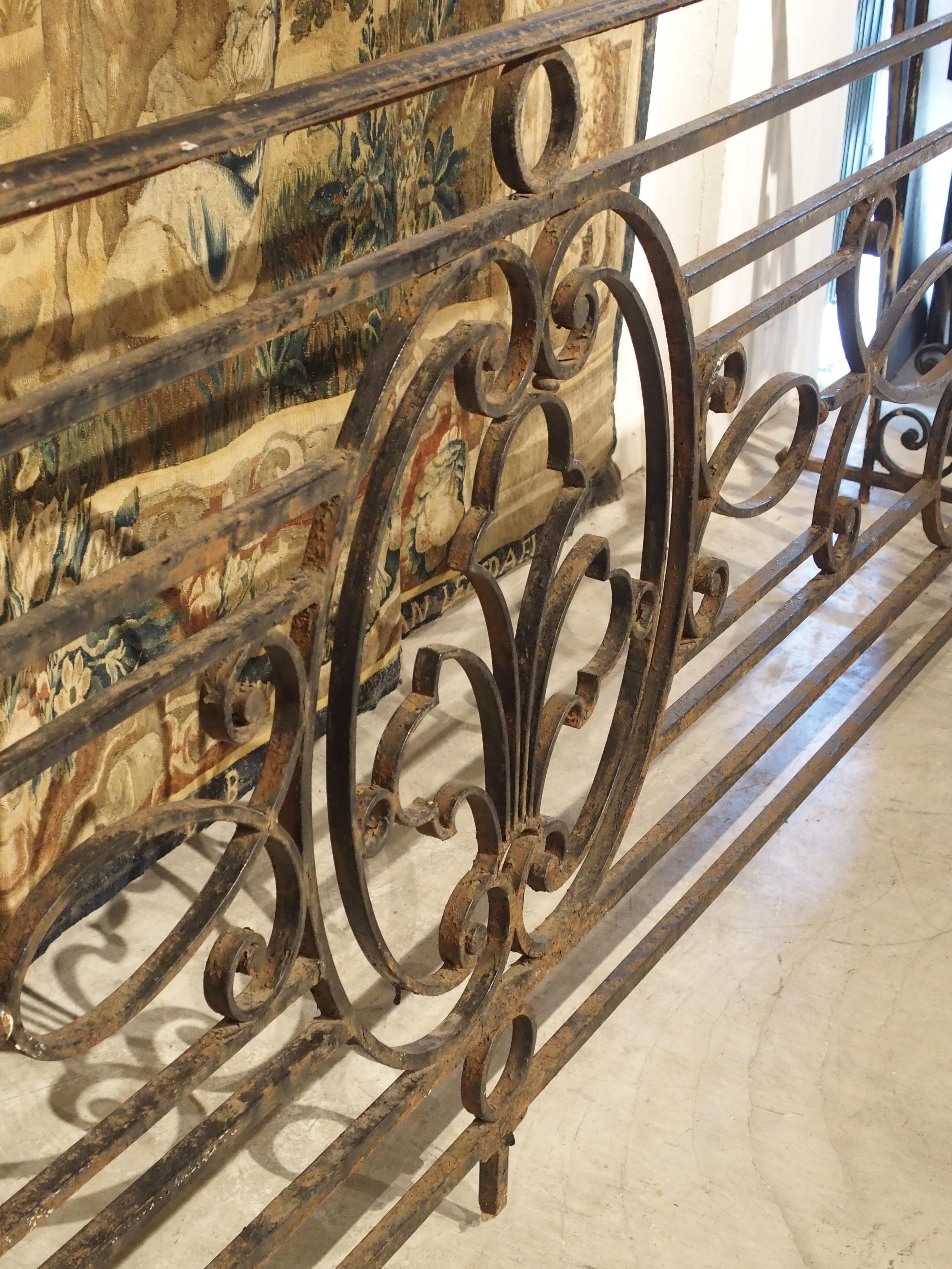 At almost 12 feet long, this long wrought iron balcony gate comes from Argentina during the Belle Époque period. The Belle Époque is generally considered to have begun in 1880 and lasted until 1914. The period is said to begin with the dethroning of