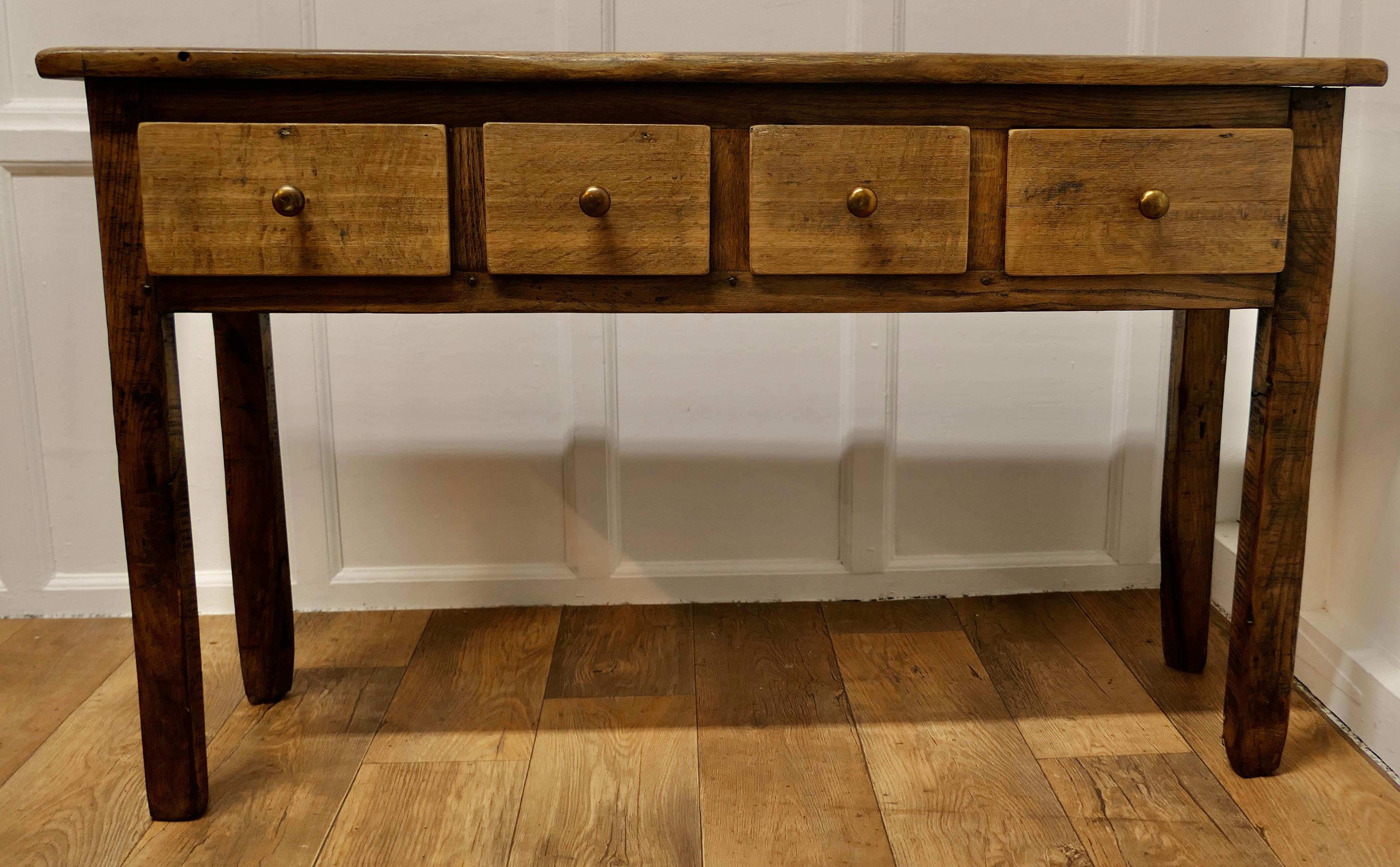A Long Blonde Oak Hall Table, Dresser or Buffet 

This is a lovely country made piece it is made in Oak which has faded over the years and now has a wonderful blonde patina
The table is set on square legs and 4 drawers to the front with a