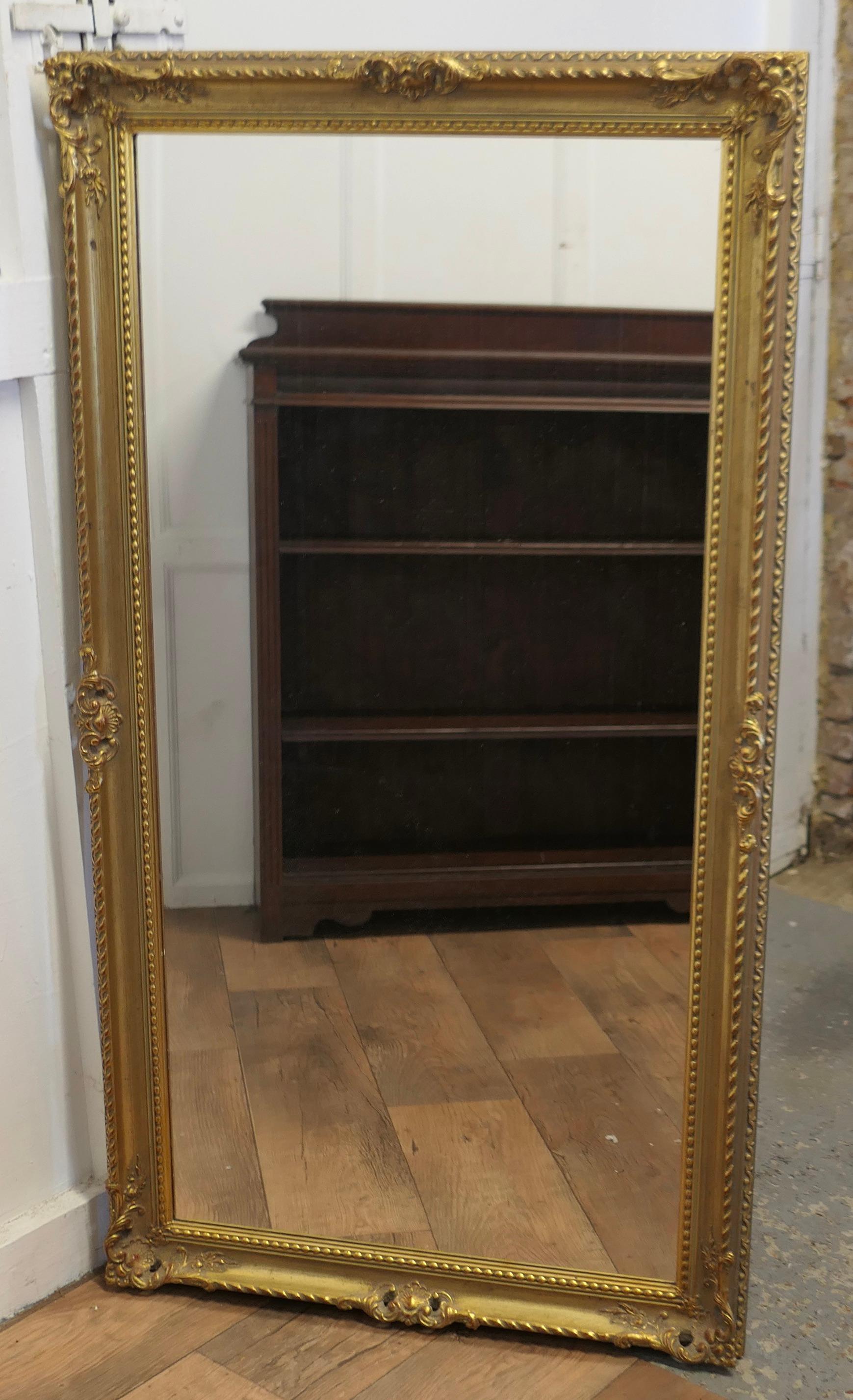 A Long Decorative Gilt Wall Mirror

A delightful piece, the mirror has a 3” wide pierced Gilt Frame, the mirror has a new looking glass
A good decorative piece in very attractive condition and could be hung either Portrait or Landscape
The frame is