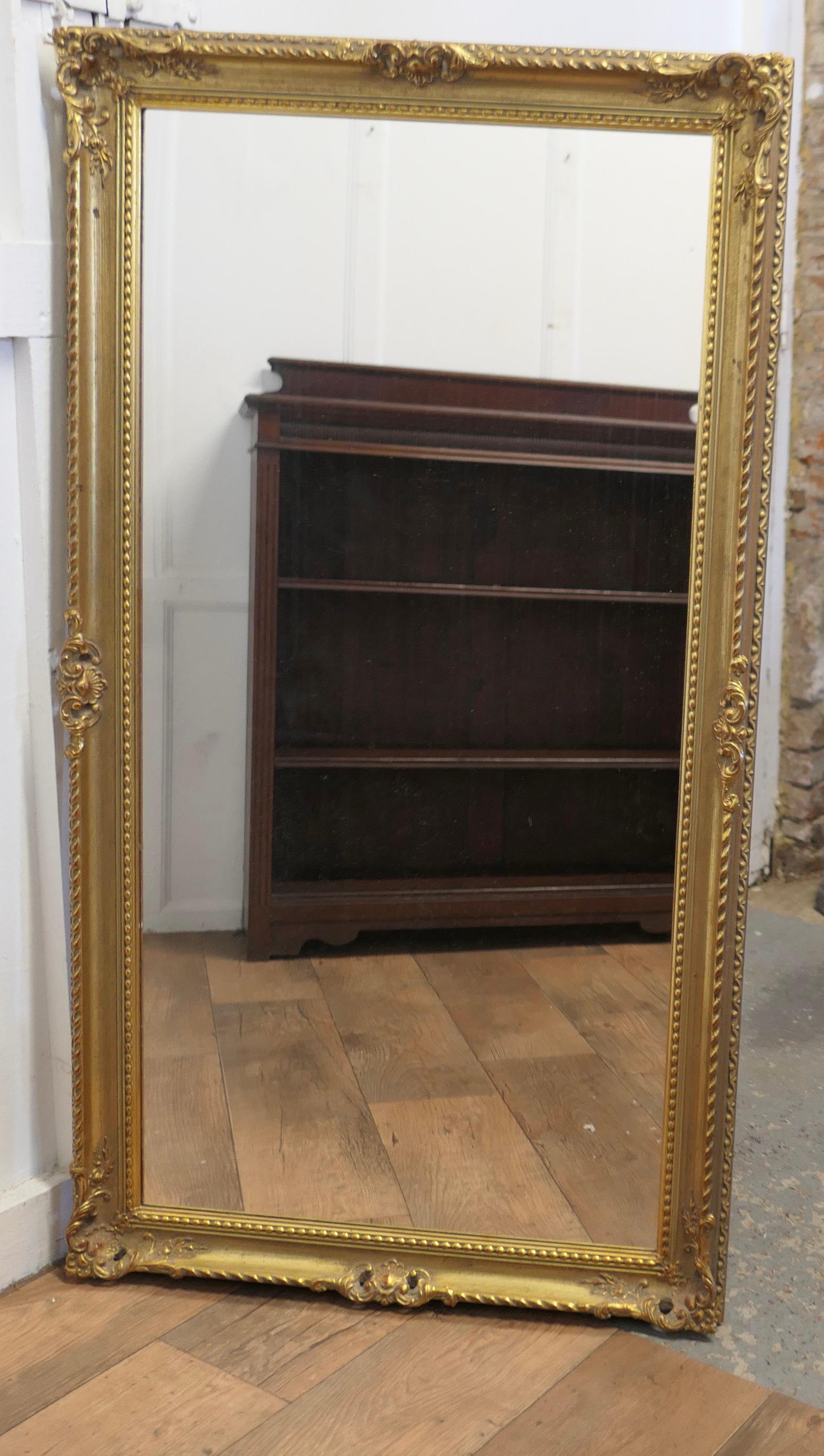Giltwood A Long Decorative Gilt Wall Mirror  A delightful piece  For Sale