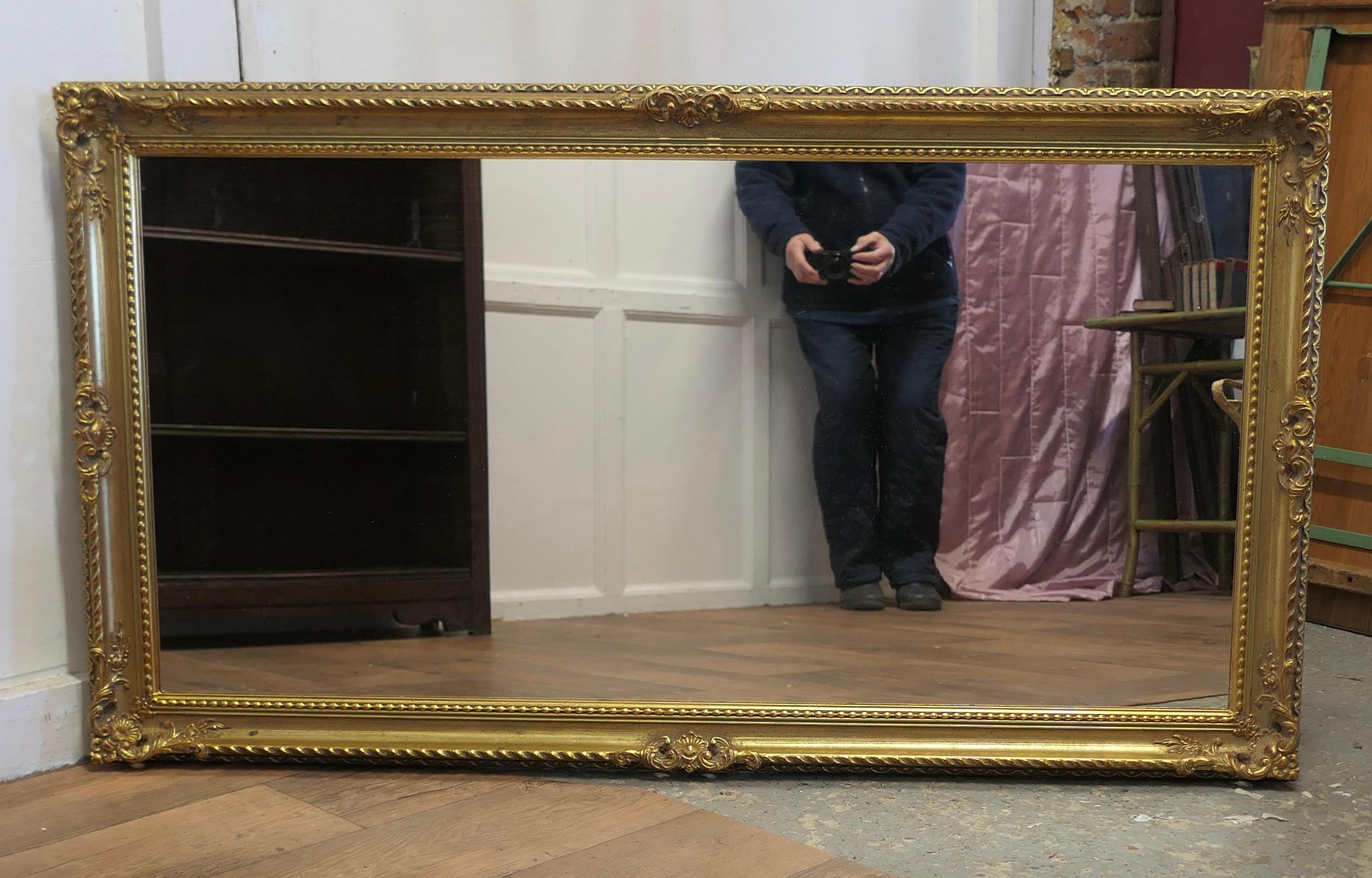 A Long Decorative Gilt Wall Mirror  A delightful piece  For Sale 1