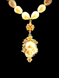 A long freshwater baroque pearl necklace with a  large freshwater pearl pendant