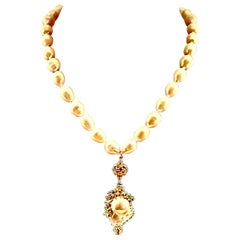 A long freshwater baroque pearl necklace with a  large freshwater pearl pendant