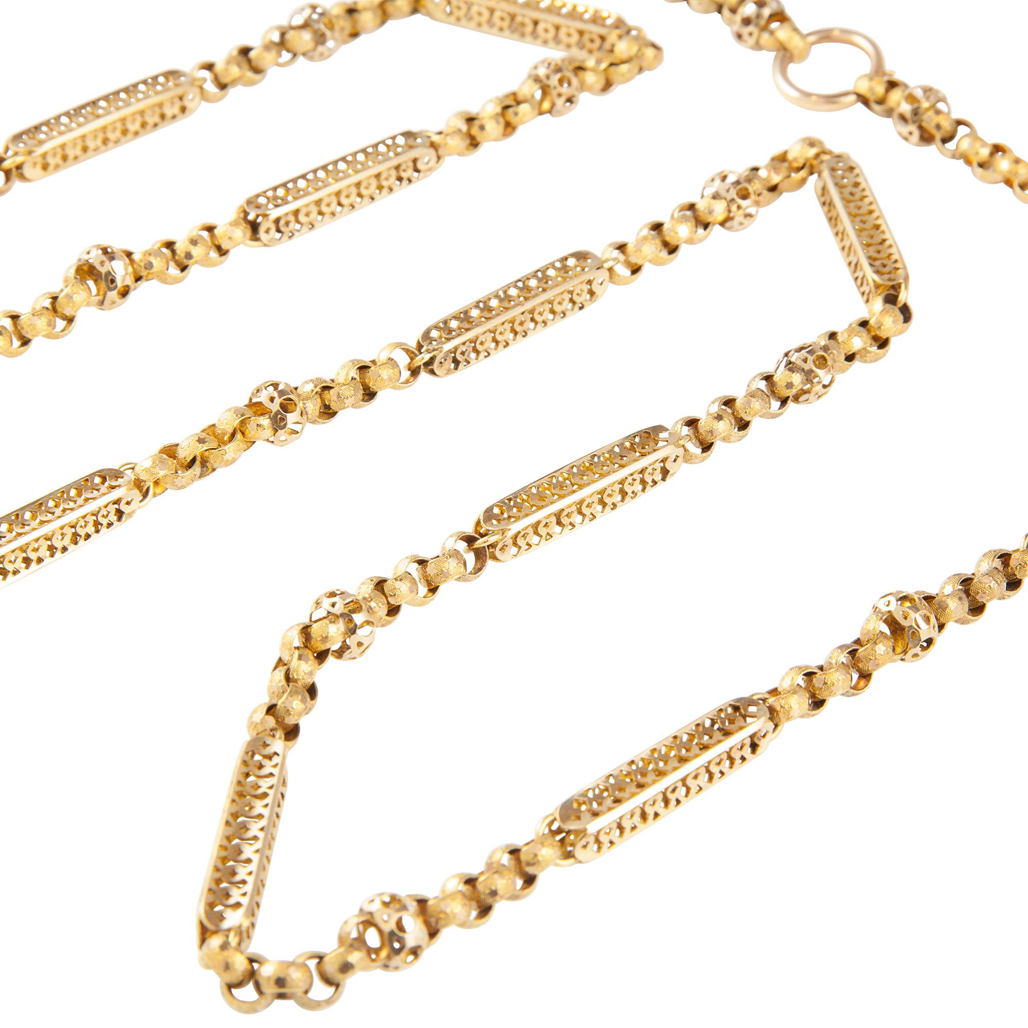 A long Georgian gold regard chain, sixteen long square pieced bars interspaced with interlocking circular links of textured yellow gold with star motifs and roundel in centre, to a bolt clasp, made in 18 carat yellow gold, circa 1800, measuring