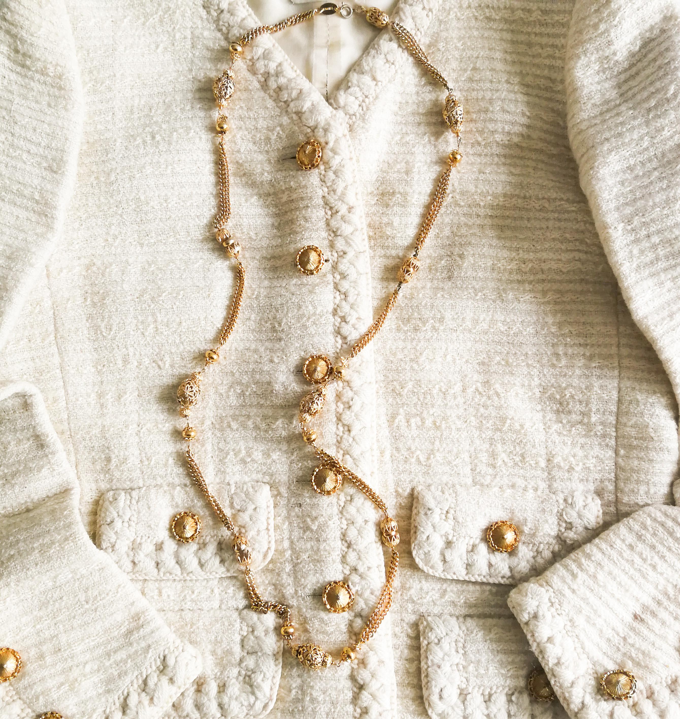 A classic piece of Chanel costume jewellery, an iconic long chain, of the type worn in the celebrated style of layering with another, or two or three. Elements, made from gilded filigree metal,  interlocking and fitting together, interspersed