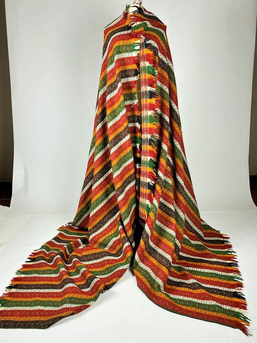 Circa 1860-1880
France Provence

Long Paisley shawl in striped wool called Bayadère, as can be seen in the iconography of Provençal painting, including the Ex-voto. Woven decoration with large saffron, andrinople red, green-yellow, black and white