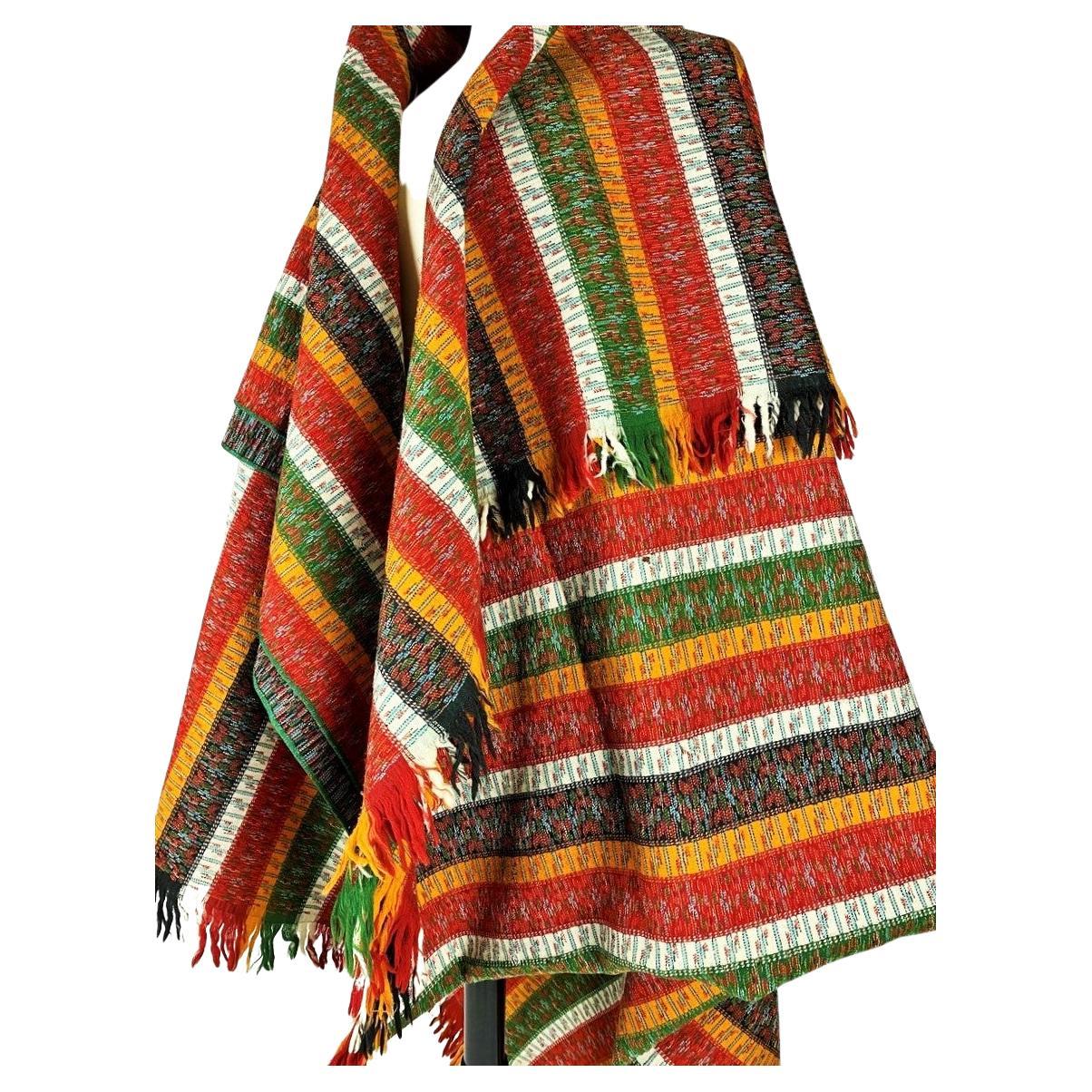 Circa 1860-1880
France
Long Paisley shawl in striped wool called Bayadère, as can be seen in the iconography of Provençal painting, including the Ex-voto. Woven decoration with large saffron, andrinople red, green-yellow, black and white stripes,