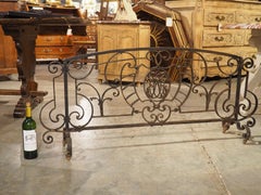 A Long, Wrought Iron French Fireplace Grille with Central Monogram, Circa 1890