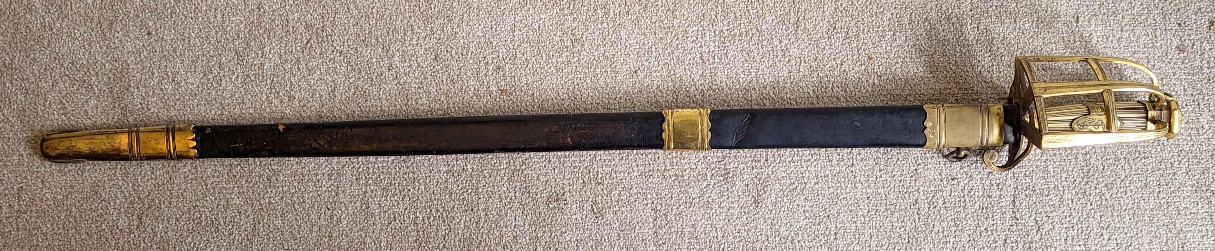 A fine and rare Naval Officers sword that dates from around 1790. It has a reeded ivory grip contained in a gilt mounted leather scabbard.

The sword is sold with a framed and glazed signed affidavit stating that it had previously been in the