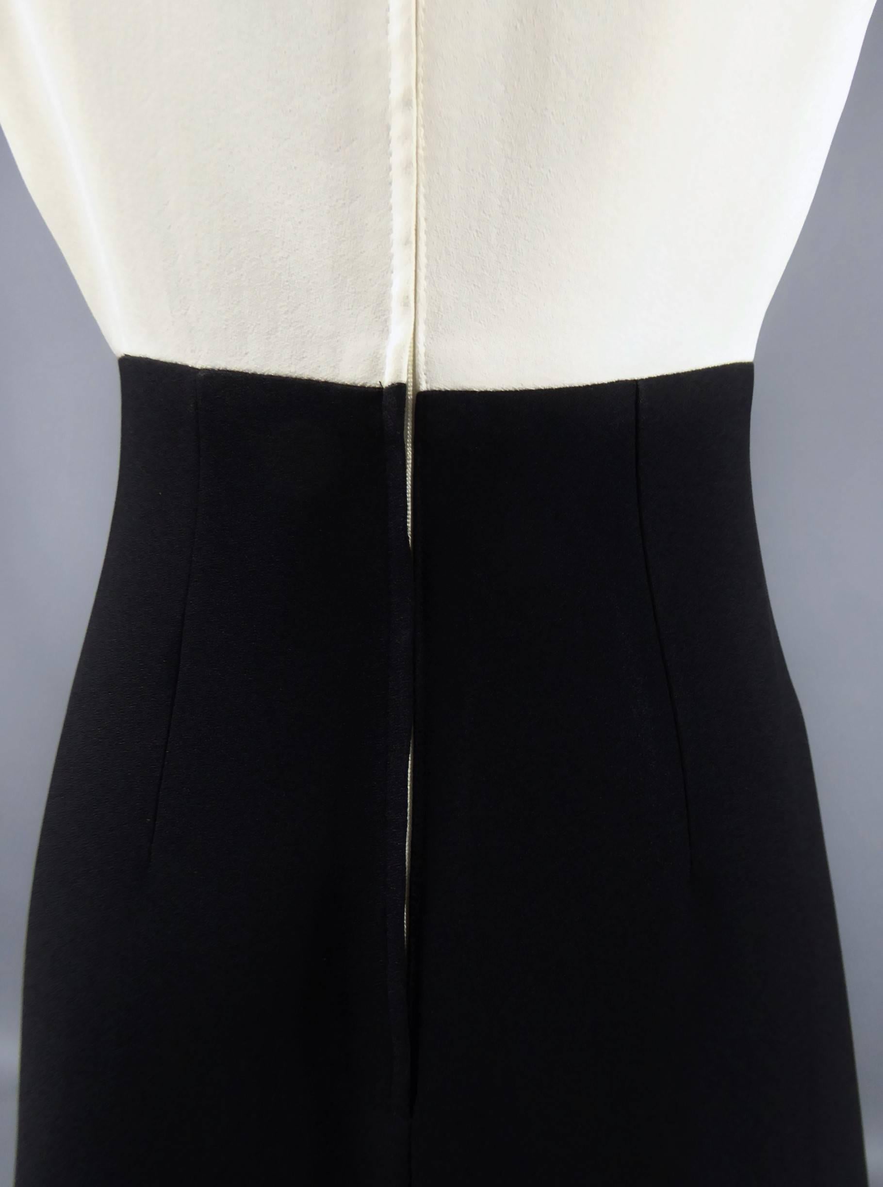 Circa 1975/80

England

Louis Féraud dress at Rembrandt, graphic design in thick black crepe on the skirt and white on the top. Heavy fabric reminding Gazar, probably supplied by the Japanese house Shimbo Fabrics (See photo). Trapezoid shape on the