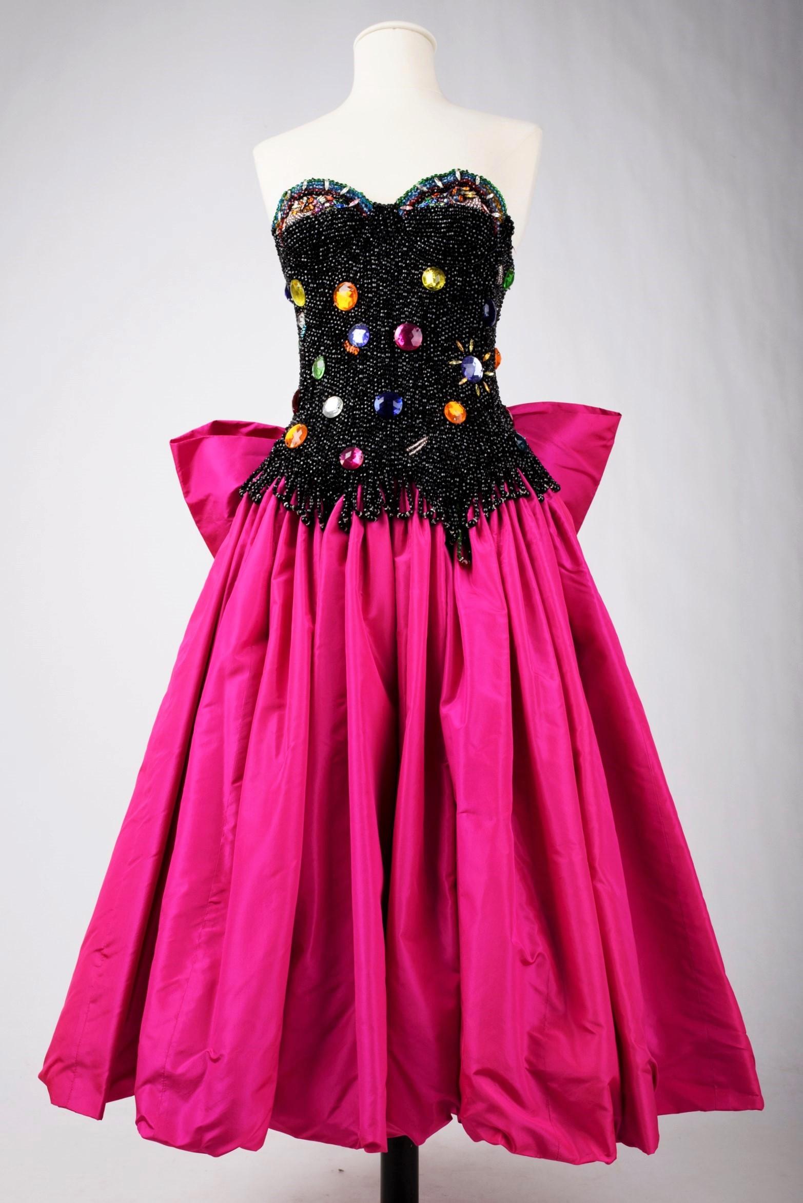 Fall-Winter 1986-1987 Collection

France

An Amazing evening gown, taken from a fairy tale, by Louis Féraud Haute Couture from the 1986-1987 collection. Bustier with plunging neckline bare back, entirely embroidered with jet beads, with large