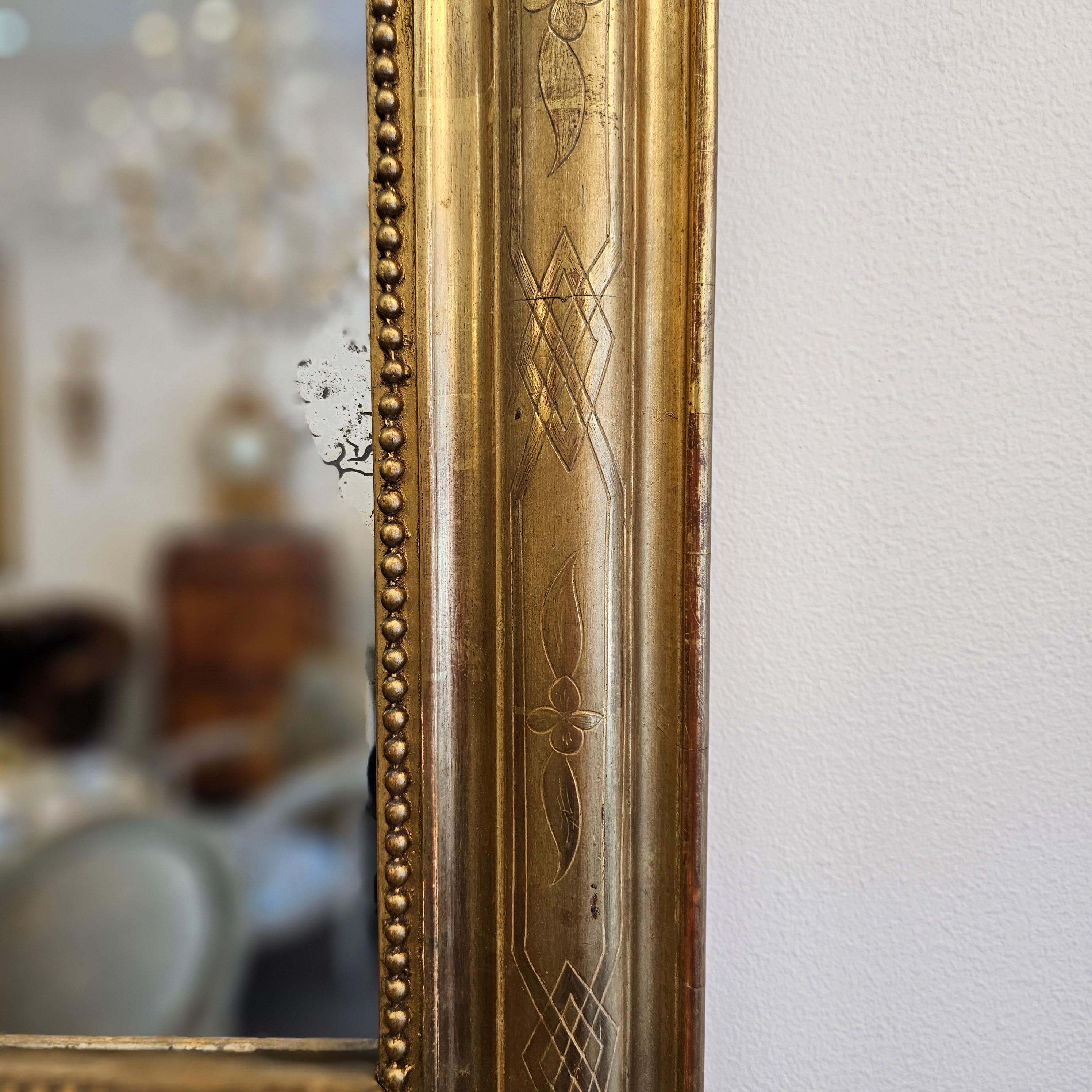 A Louis Philippe Period Gilt Mirror with Crest

c.1850, France

A beautiful antique mirror that originates in France. The mirror has the upper rounded corners typical for Louis Philippe mirrors. A beautifully carved ornamented crest with foliate
