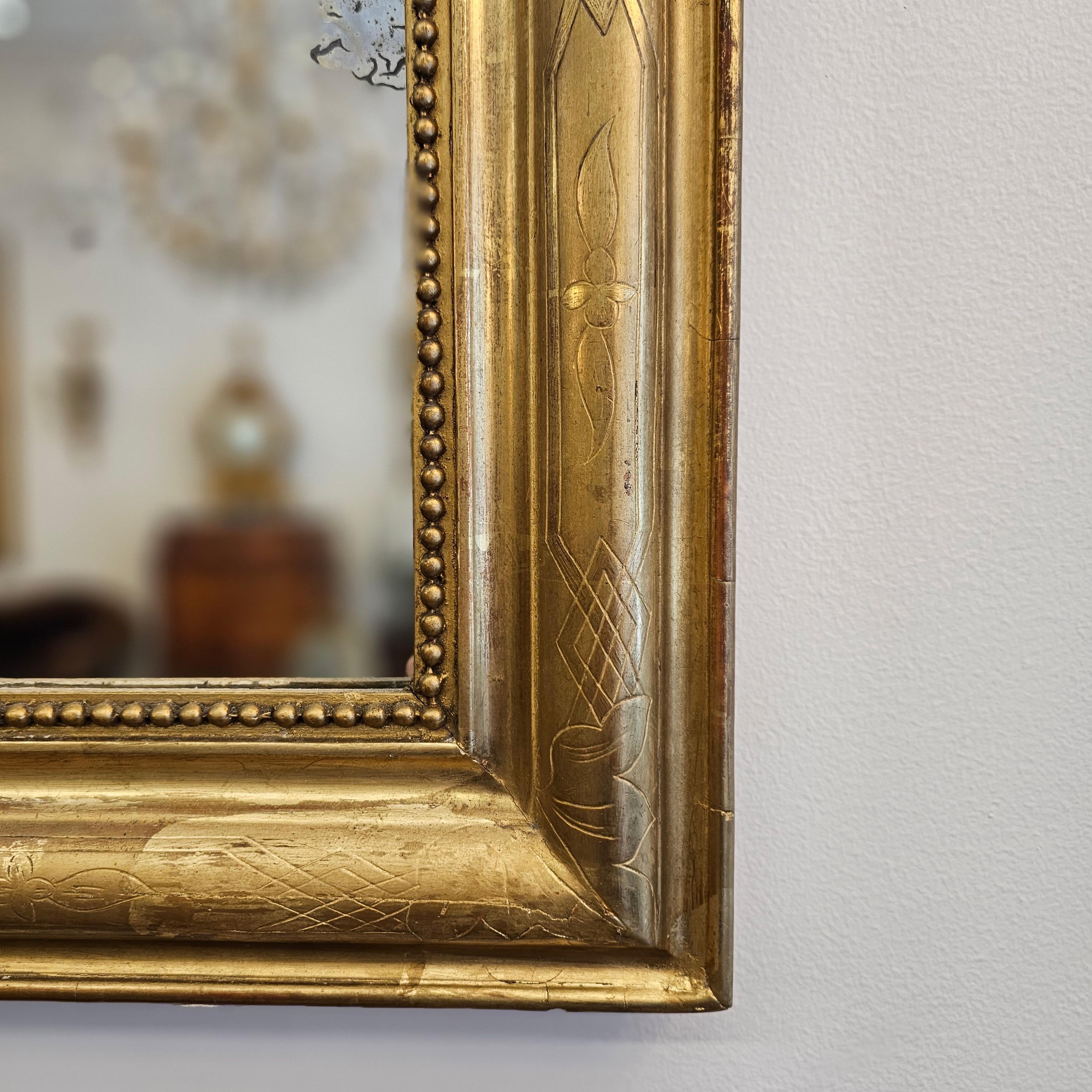 French Louis Philippe Period Gilt Mirror with Crest For Sale