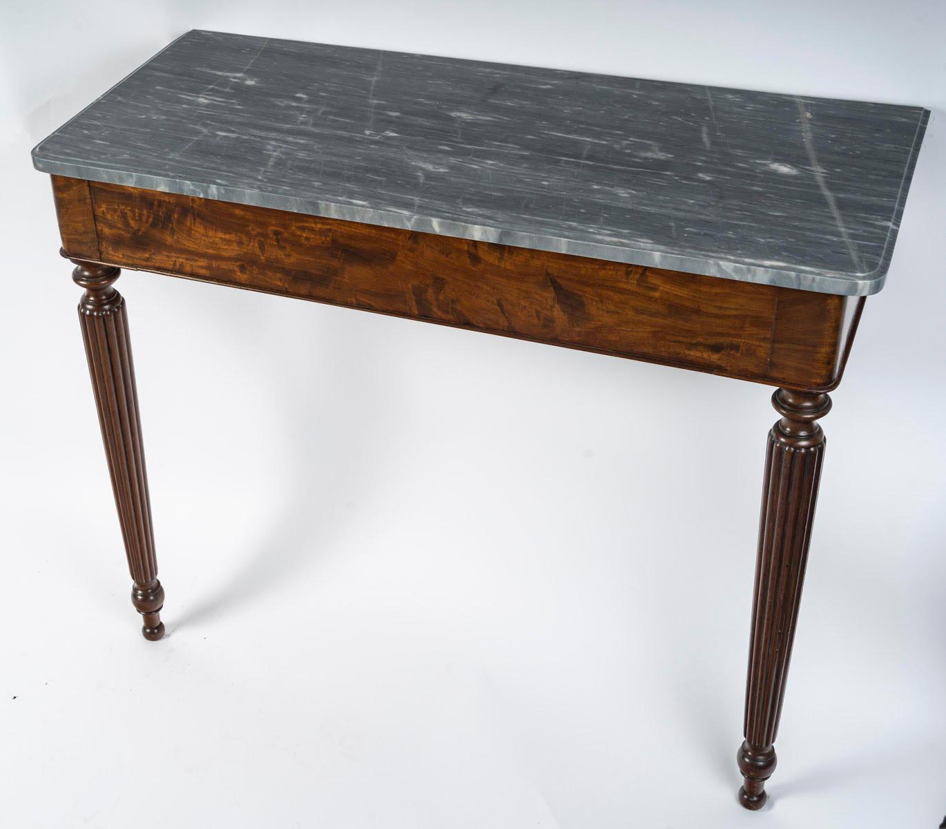 A Louis Philippe period mahogany and marble top console table, 19th century.

Louis Philippe period mahogany wall console with marble top, 19th century.  
h: 71,5cm, w: 87cm, d: 37cm