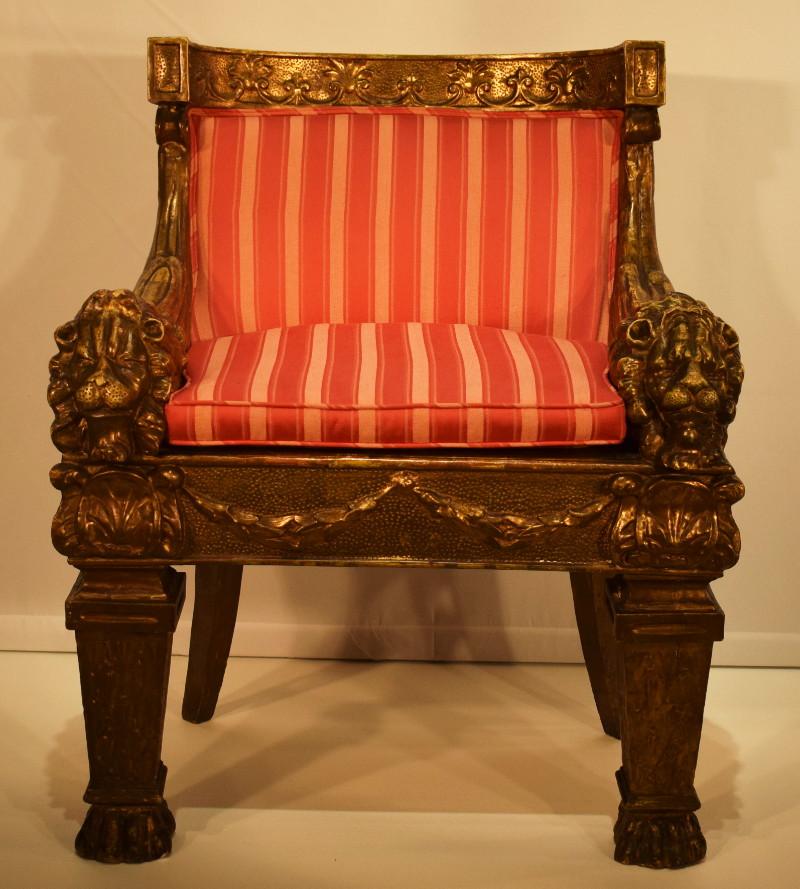A Louis XIV style giltwood barrel back lion chair
Height 35 1/2 x width 30 inches.