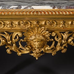Une console de style Louis XIV en bois doré, avec plateau en marbre