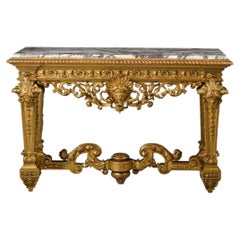 Une console de style Louis XIV en bois doré, avec plateau en marbre