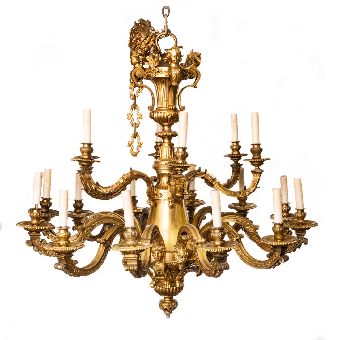 A Louis XIV style ormolu eighteen-light chandelier,
after the model by Andre-Charles Boulle,
19th century.
The urn-form baluster stem surmounted with putto terms, the spreading lower section issuing two tiers of scrolling candlearms, those of the