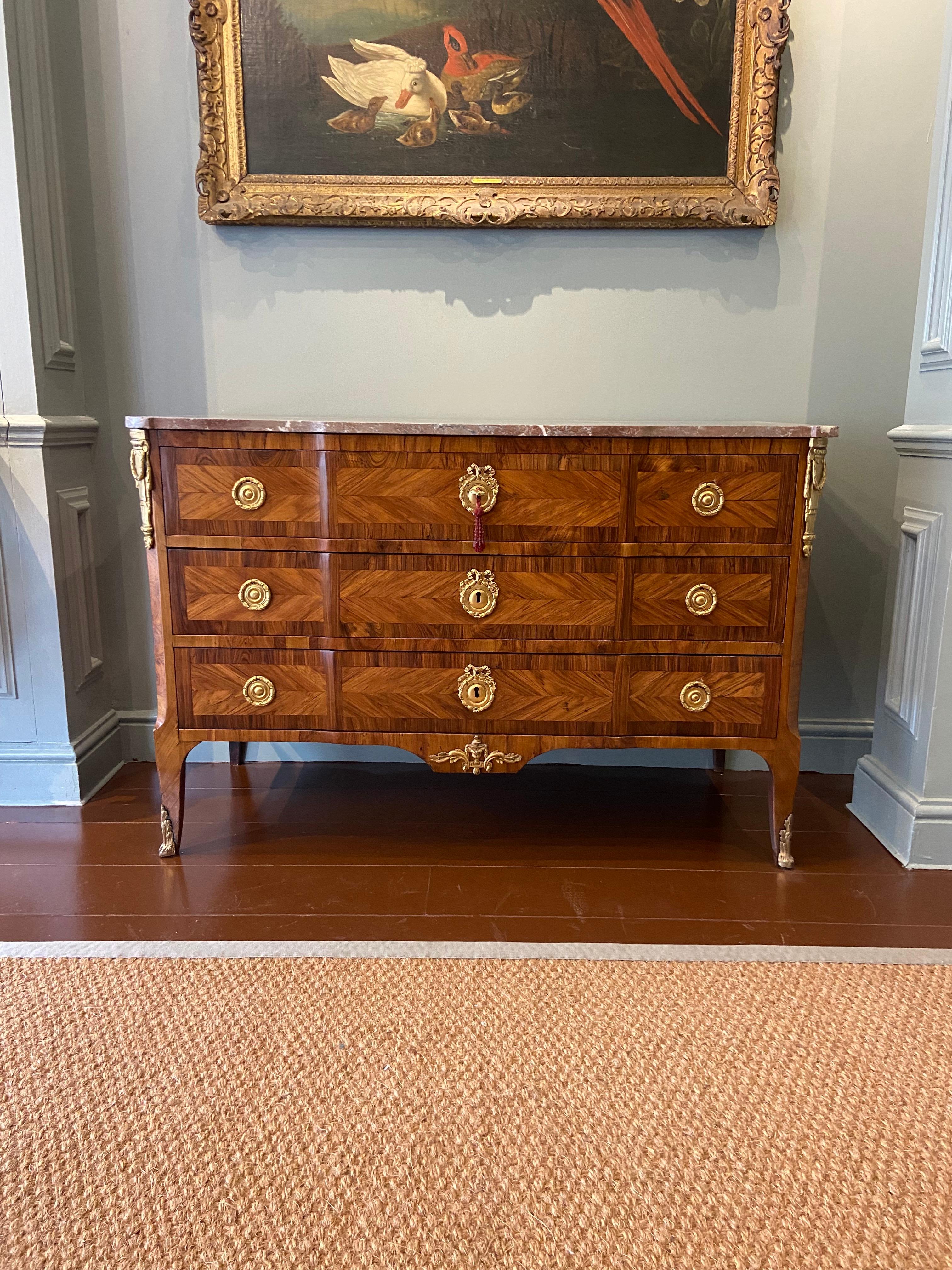 A Louis XV Ormolu-Mounted Kingwood and Fruitwood Commode (Mid 18th Century). Stamped 'P. Roussel' and 'JME