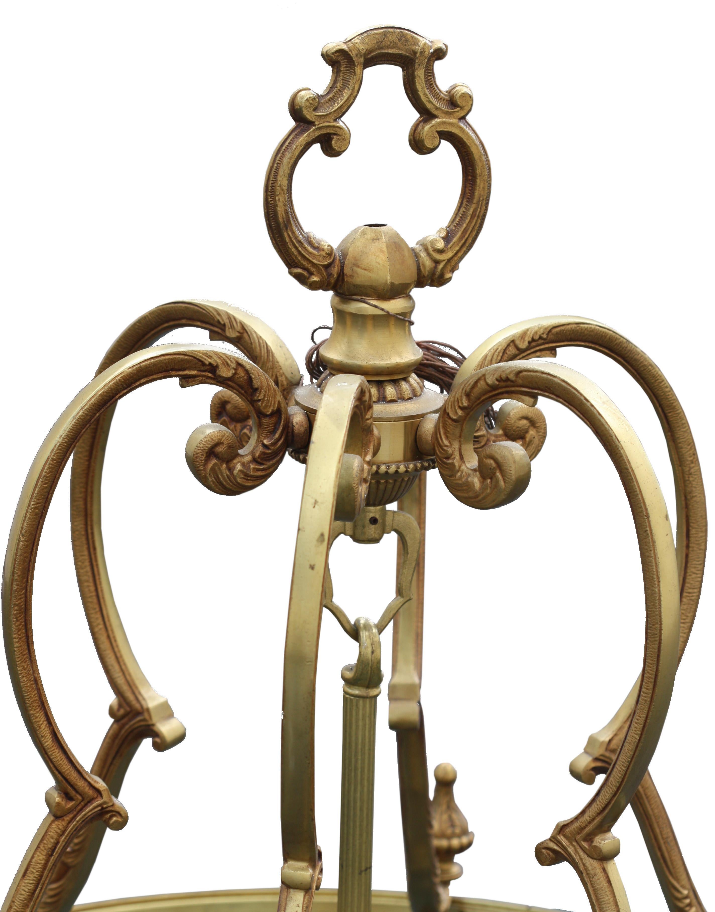 Property removed from Kirk House, Miami
A Louis XV style bronze hanging lantern/chandelier
20th century
of circular form with shaped glass sides, nine-light inner chandelier
Measures: 117cm. high, 48cm. wide; 3ft. 10in.