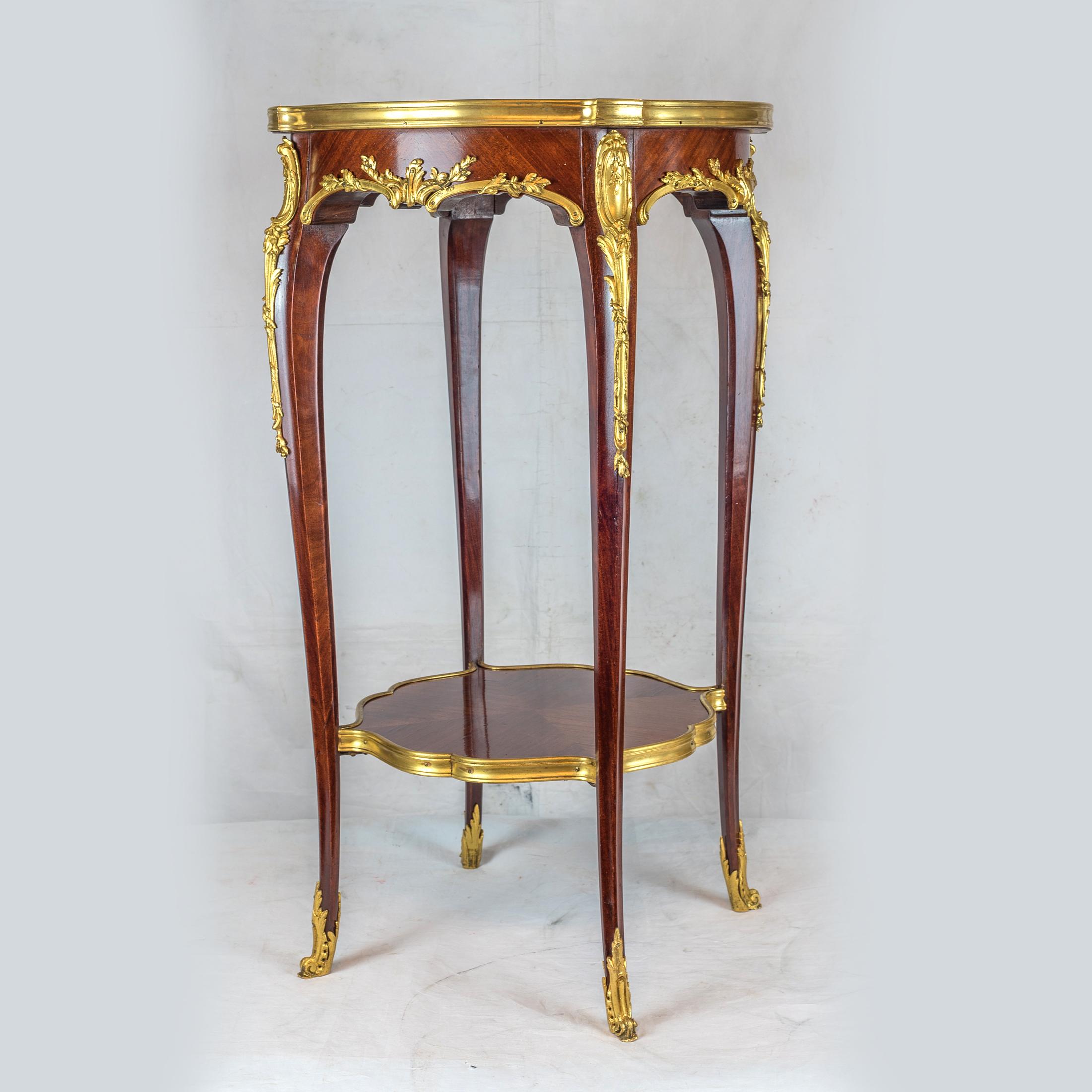 A fine Louis XV style gilt bronze mounted mahogany and marble-top side table.

Attributed to Joseph-Emmanuel Zwiener (1848-1895)
Origin: French
Date: 19th century
Dimension: H 29 3/8 in x D 16 1/2 in.