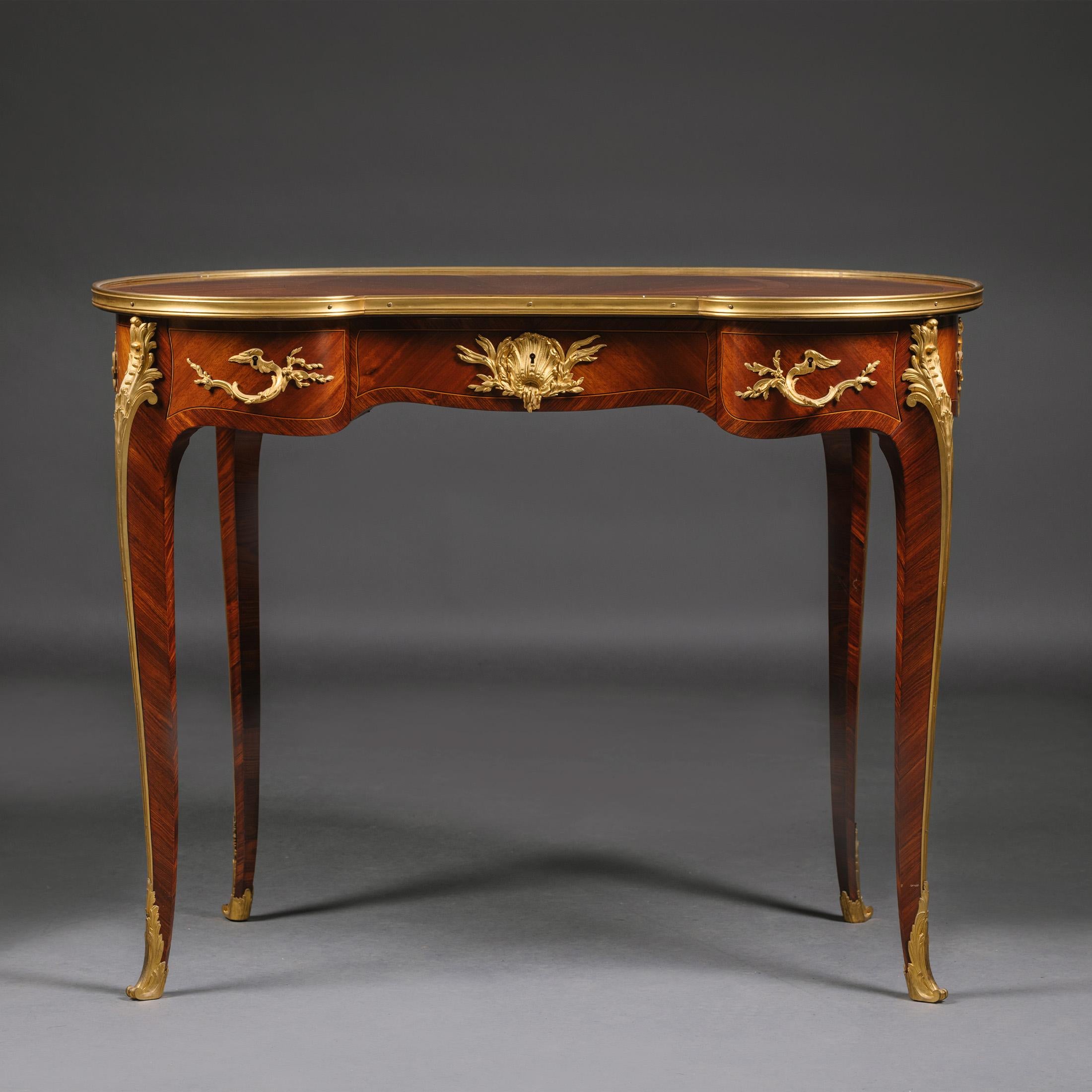 A Louis XV Style  Gilt-Bronze Mounted Table by François Linke.

Signed to the bronze rim ‘Linke’.  
Linke Index Number. 593.

This rare table can serve as a desk, dressing table or occasional table. It has a kidney shaped top finely inlaid with