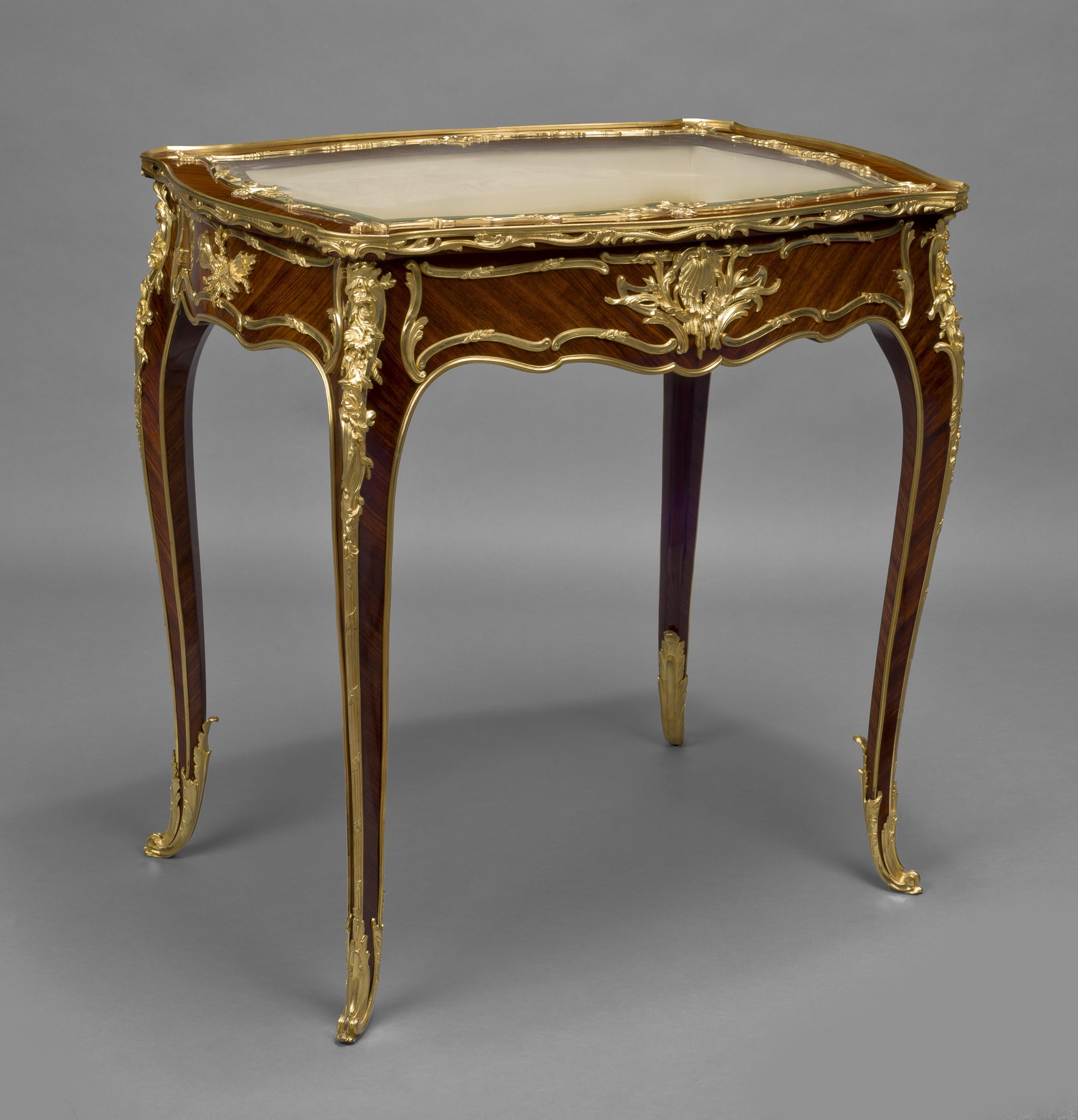 A Fine Louis XV Style Gilt-Bronze Mounted Table Vitrine by François Linke. 

French, circa 1900. 

Linke Index Number 131. 

The lockplate signed 'F.Linke', the mounts variously incised 'FL', the escutcheon stamped 'FL 2385'. The lock plate