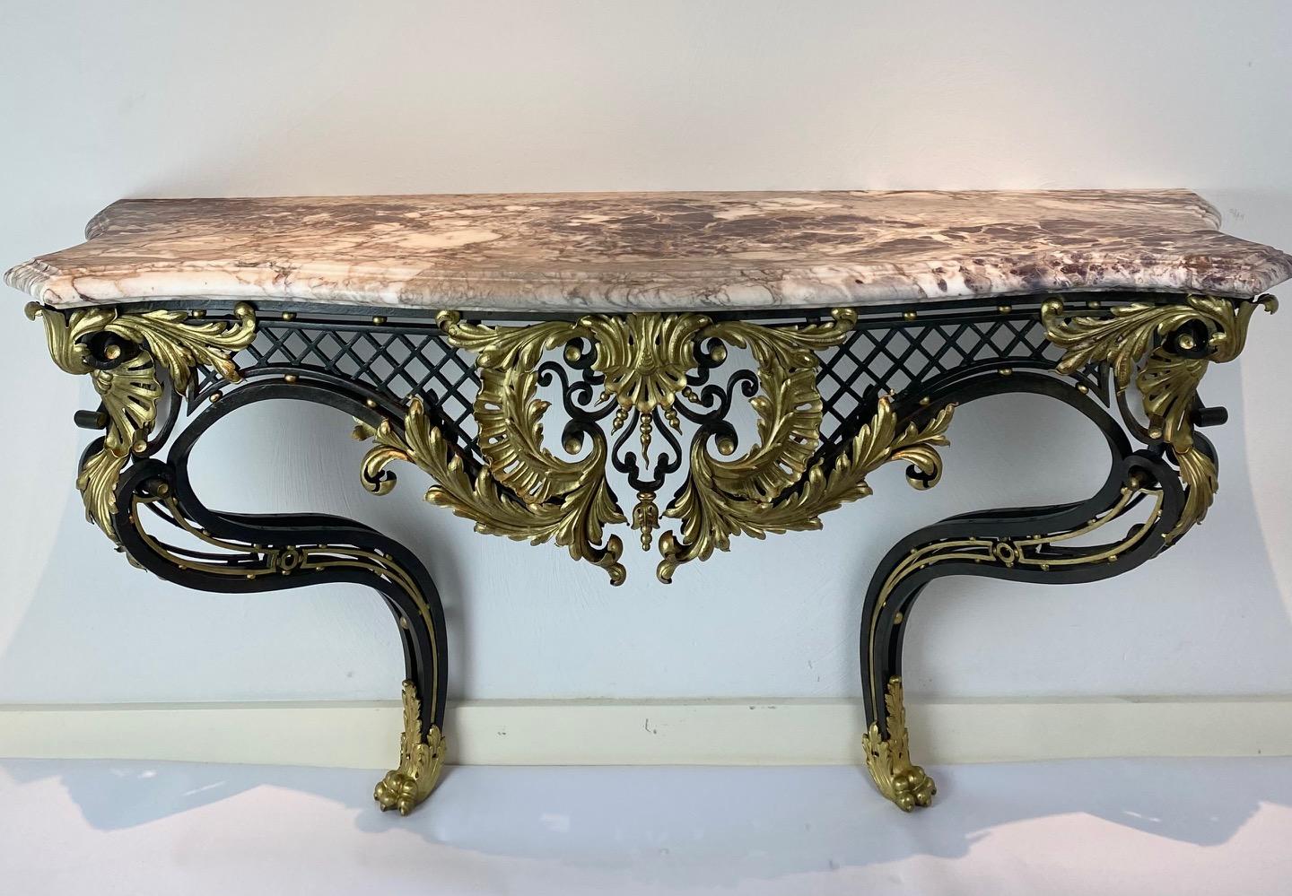 A large wrought iron and gilded bronze console in the Louis XV style with superb Breccia Violet marble top on bronze claw feet

Top quality!

France c1880s.
