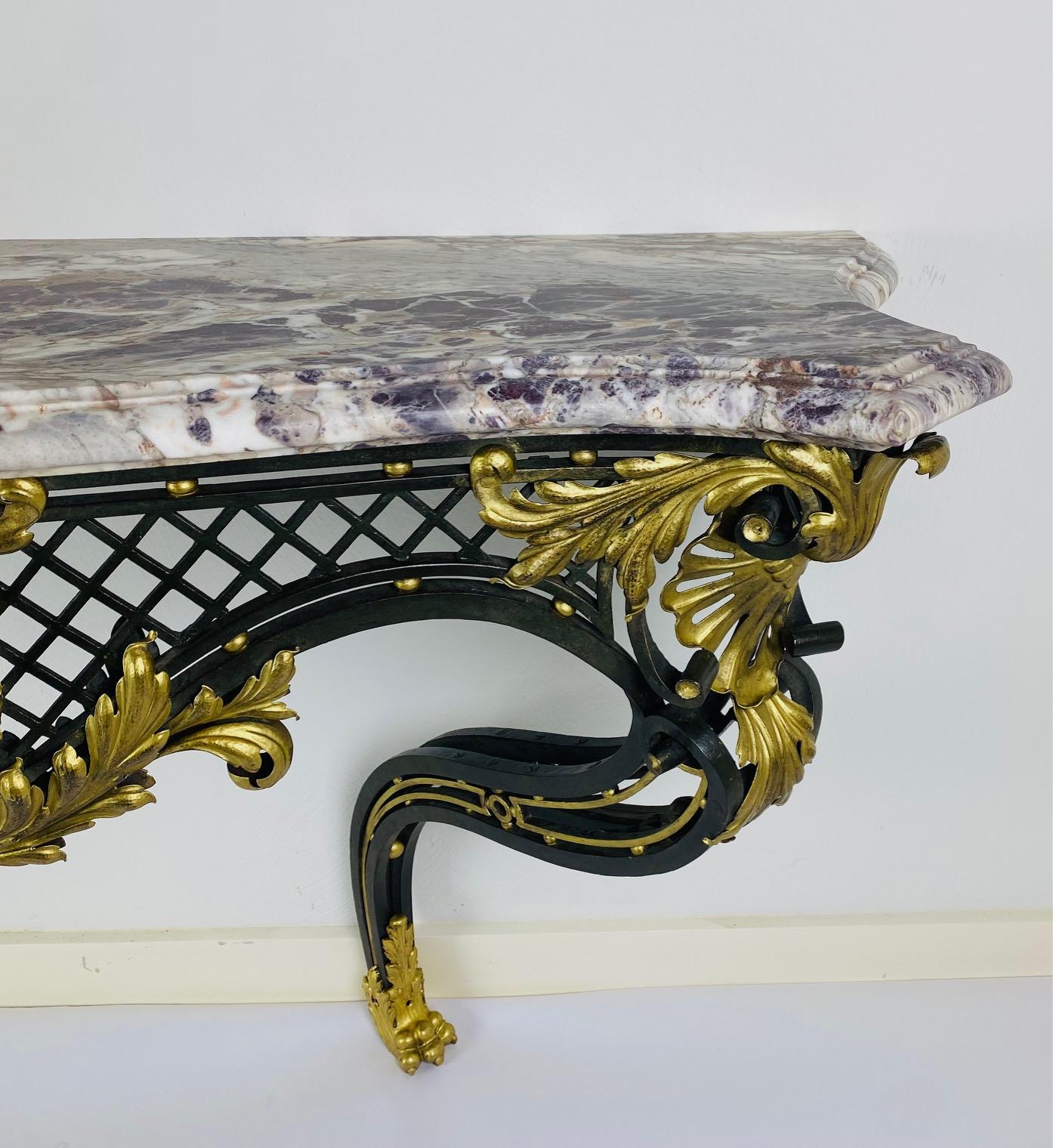 Bronze A Louis XV style iron console with breccia violet top. For Sale