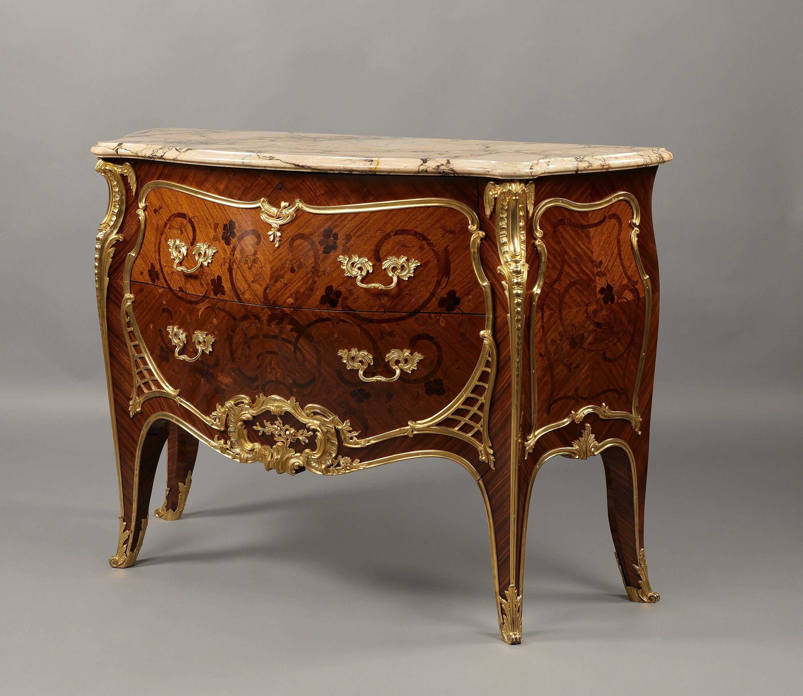 A Louis XV style gilt bronze mounted marquetry commode with marble top, possibly by François Linke.

French, circa 1900.

Stamped 'Mon LEGER' to the back of the commode for the retailer Émile Léger et Cie. 

This unusual marquetry and gilt